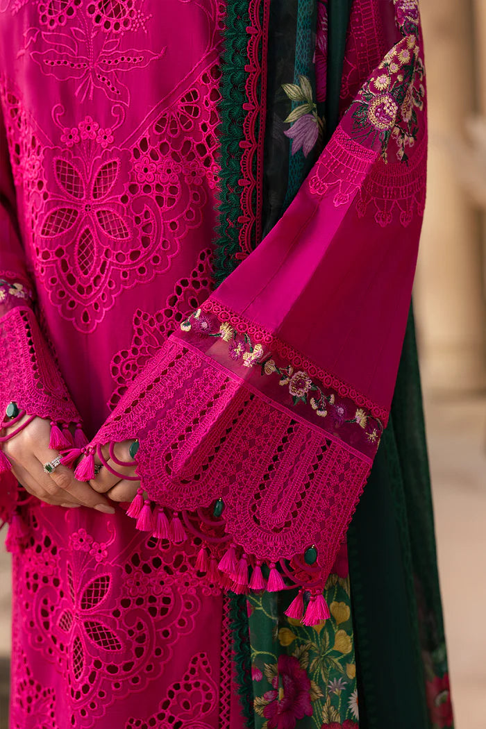 Model wearing hot pink embroidered three-piece suit with dark green printed dupatta from Saira Rizwan, Pakistani luxury pret, Pakistani clothes online in UK.