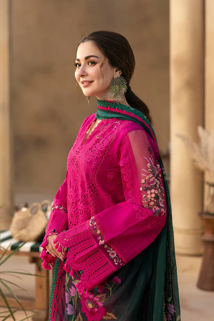 Model wearing hot pink embroidered three-piece suit with dark green printed dupatta from Saira Rizwan, Pakistani luxury pret, Pakistani clothes online in UK.