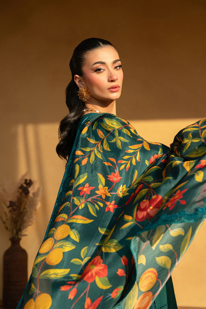 Model wearing emerald green embroidered dress with floral printed dupatta from Saira Rizwan, Pakistani luxury pret, Pakistani clothes online in UK.