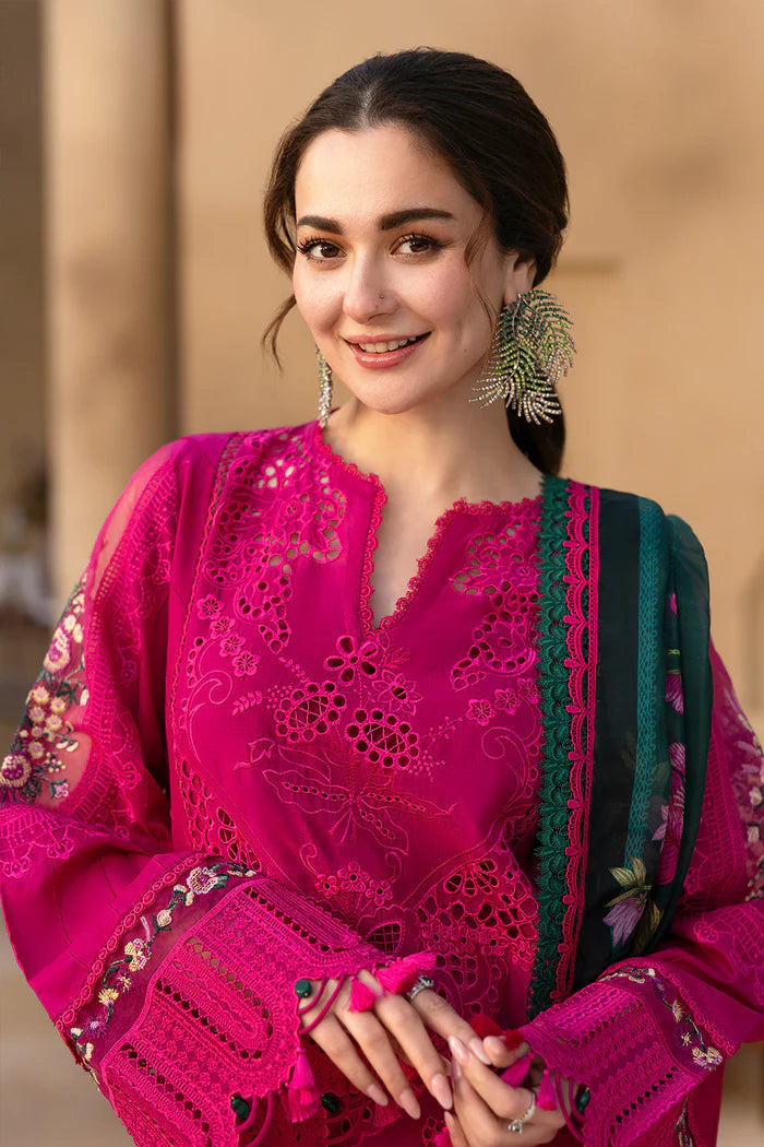 Model wearing hot pink embroidered three-piece suit with dark green printed dupatta from Saira Rizwan, Pakistani luxury pret, Pakistani clothes online in UK.