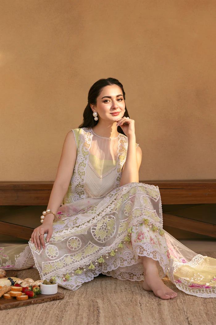 Model wearing pastel green and ivory embroidered long frock with floral dupatta from Saira Rizwan, Pakistani luxury pret, Pakistani clothes online in UK.