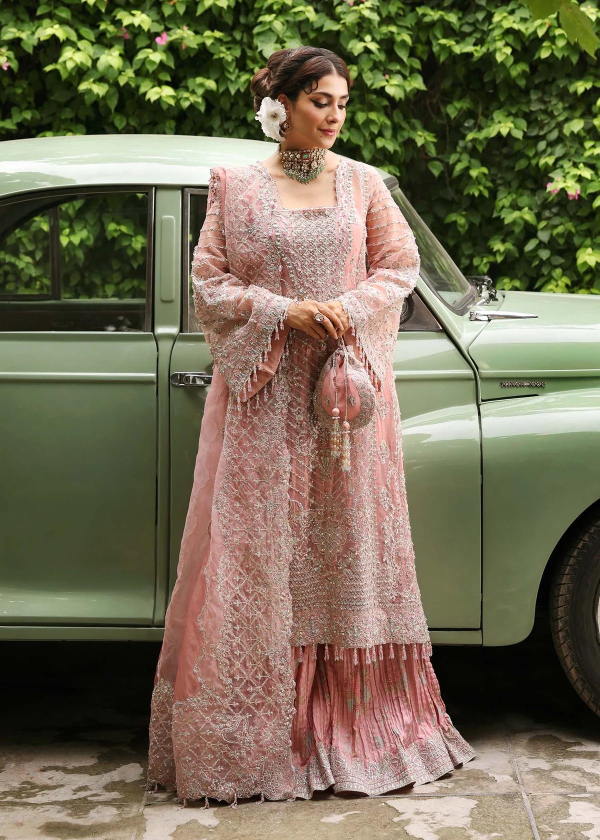 Model wearing Huriya by Kanwal Malik in black heavily embroidered outfit – Pakistani luxury pret available online in UK for festive wear.