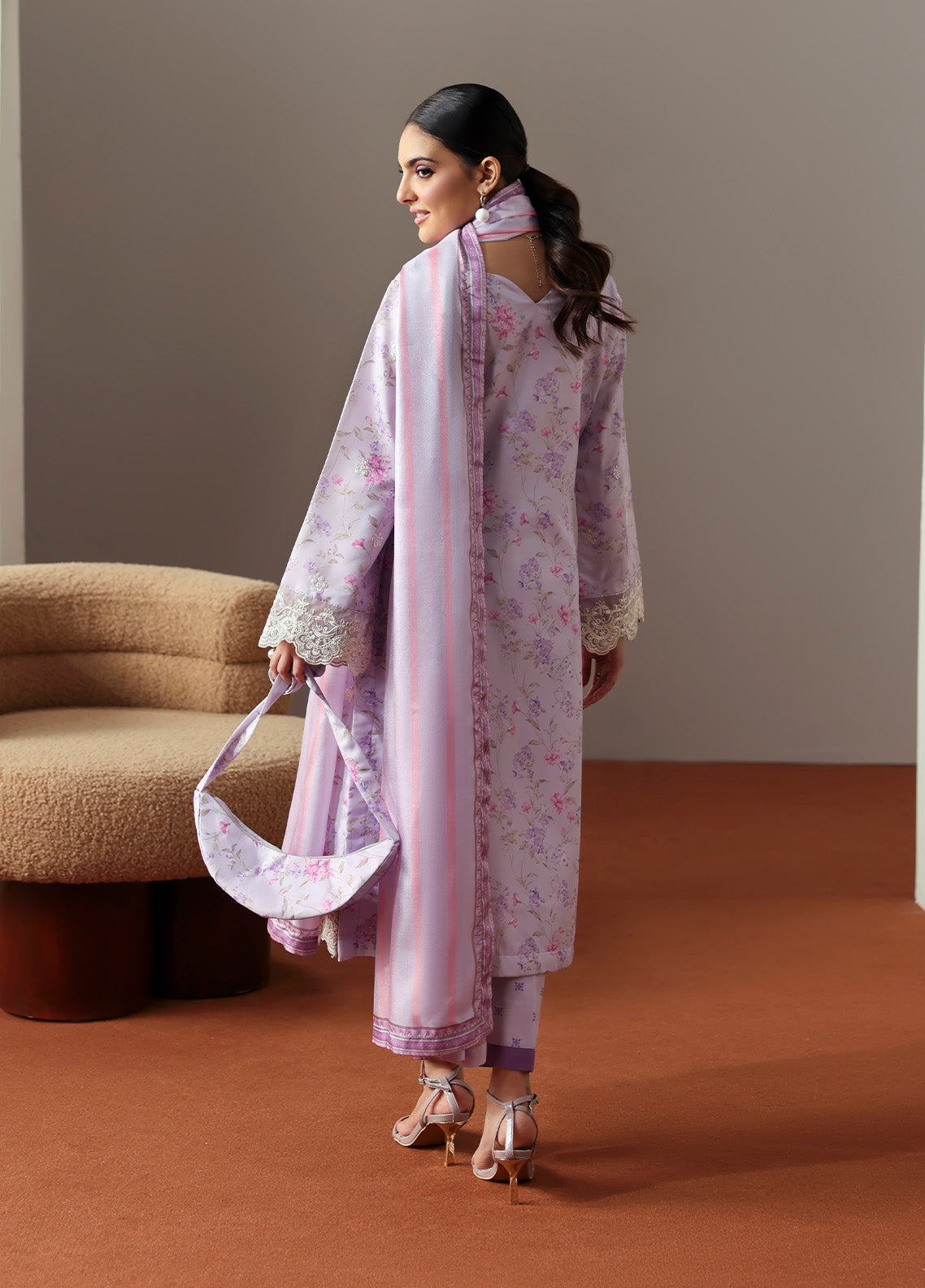 Model wearing Quince from Gulaal in a soft lavender printed co-ord set with lace detailing and striped dupatta, perfect for Pakistani luxury pret in the UK.