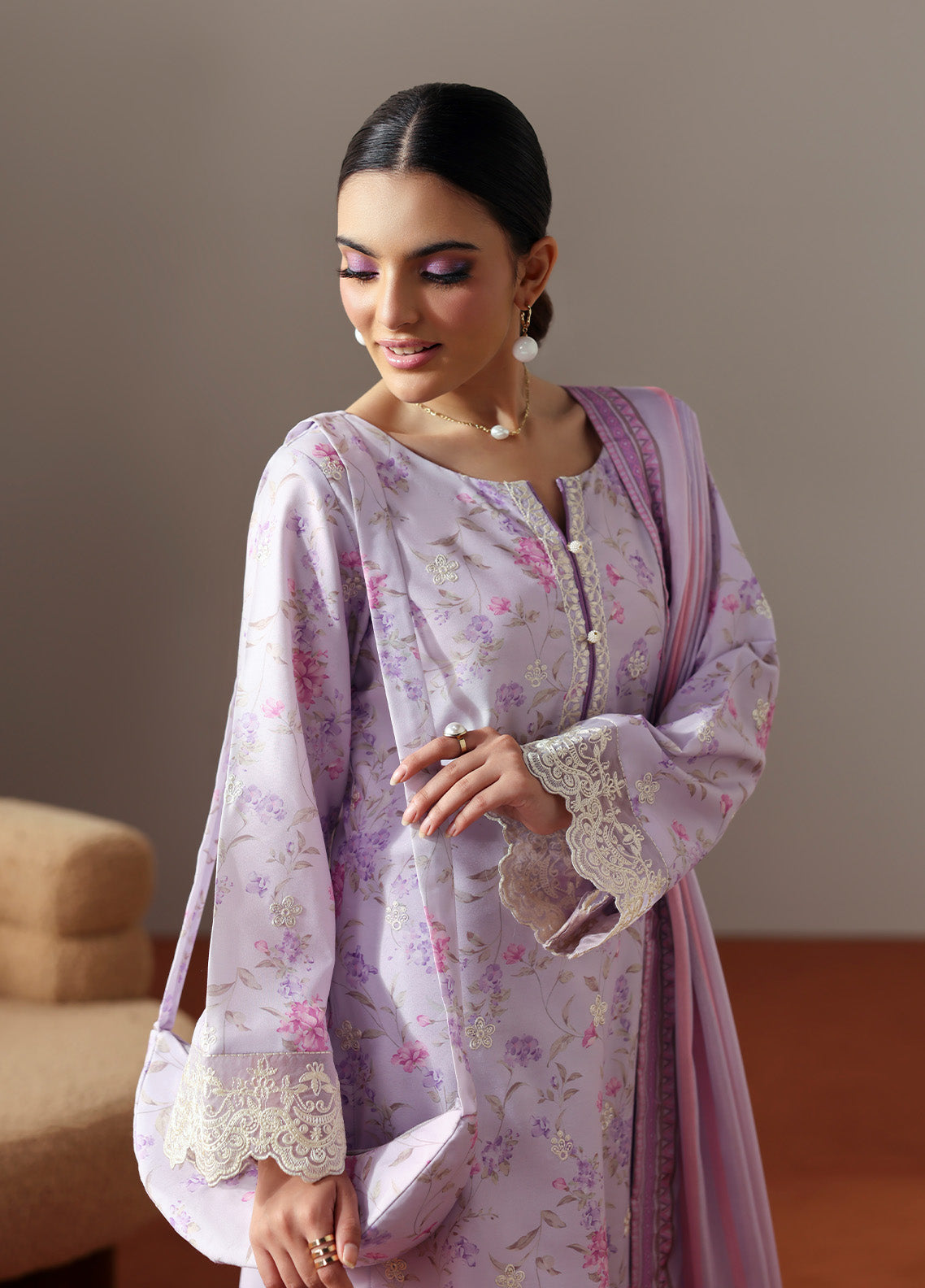 Model wearing Quince from Gulaal in a soft lavender printed co-ord set with lace detailing and striped dupatta, perfect for Pakistani luxury pret in the UK.