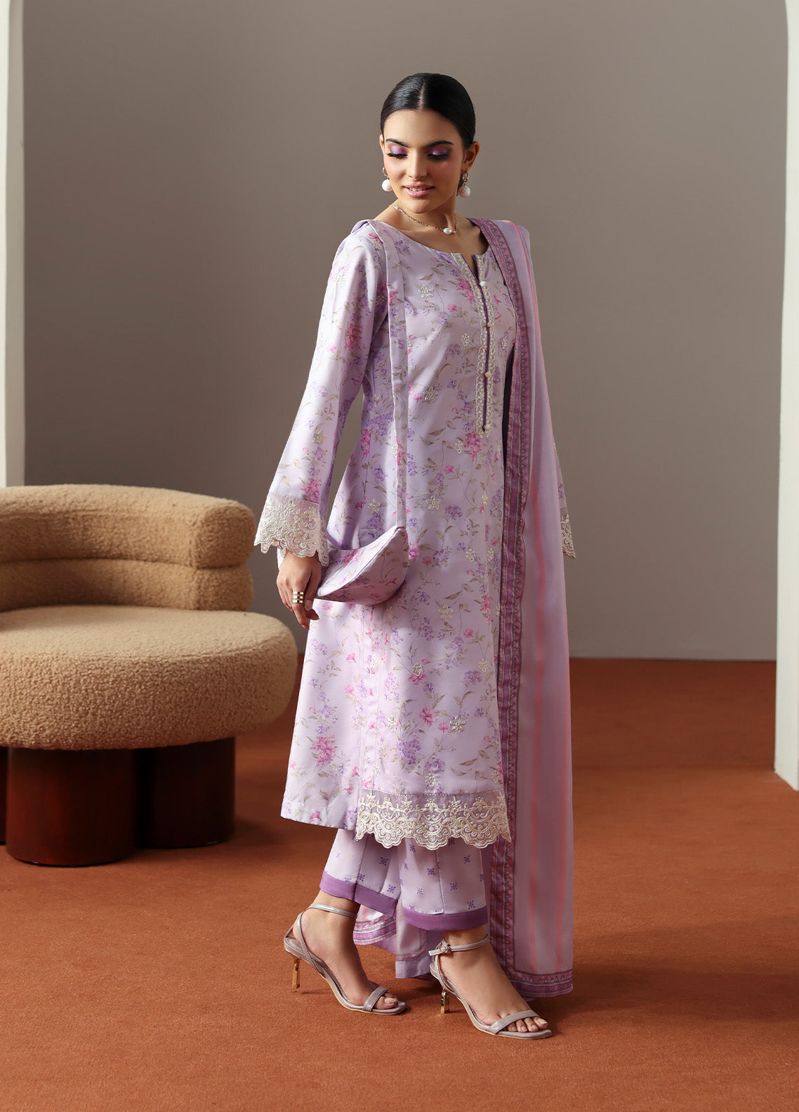 Model wearing Quince from Gulaal in a soft lavender printed co-ord set with lace detailing and striped dupatta, perfect for Pakistani luxury pret in the UK.