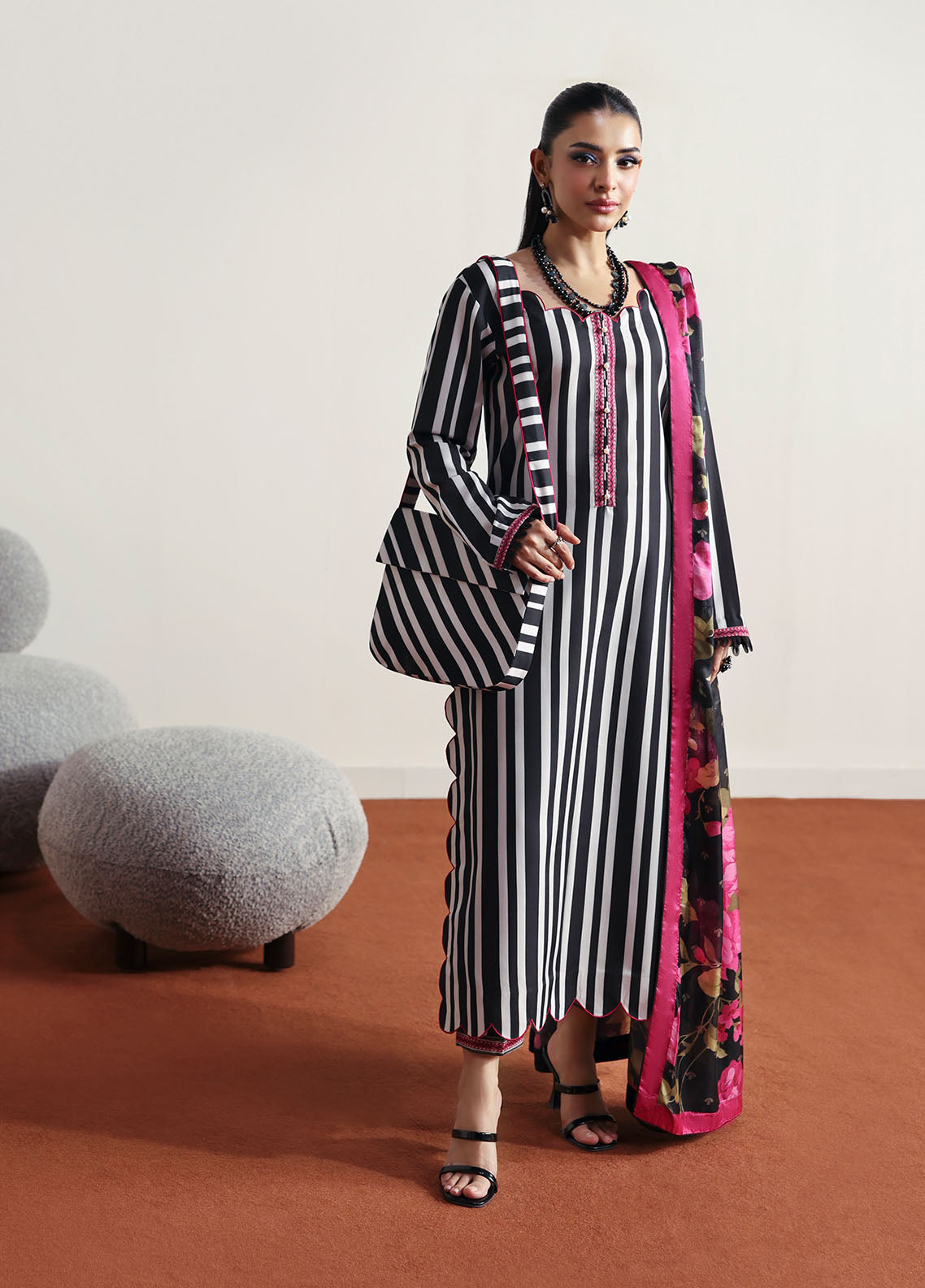 Model wearing black and white striped outfit with floral dupatta from Gulaal Basics | Fleuron, ideal Pakistani luxury pret in UK.