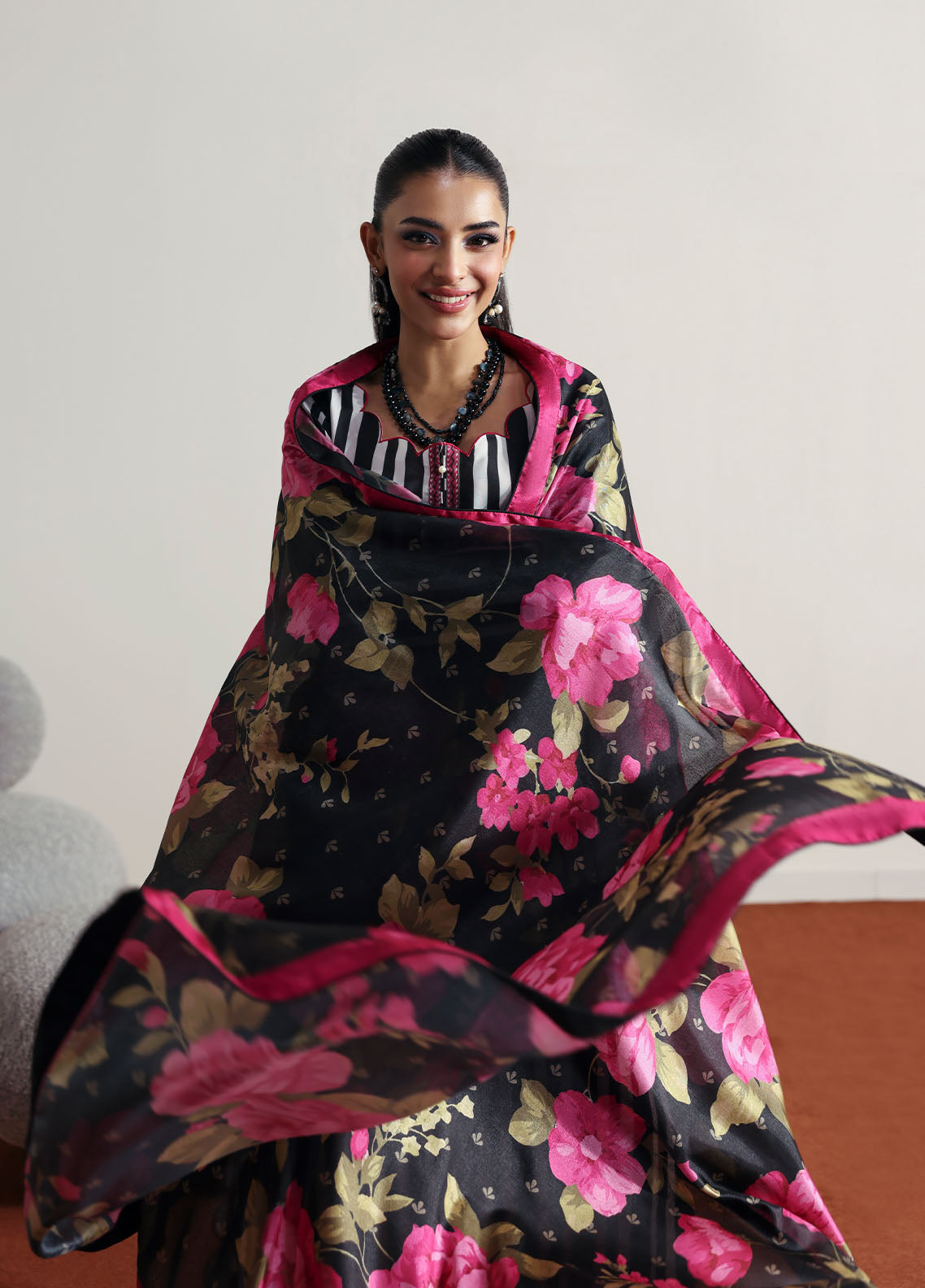 Model wearing black and white striped outfit with floral dupatta from Gulaal Basics | Fleuron, ideal Pakistani luxury pret in UK.