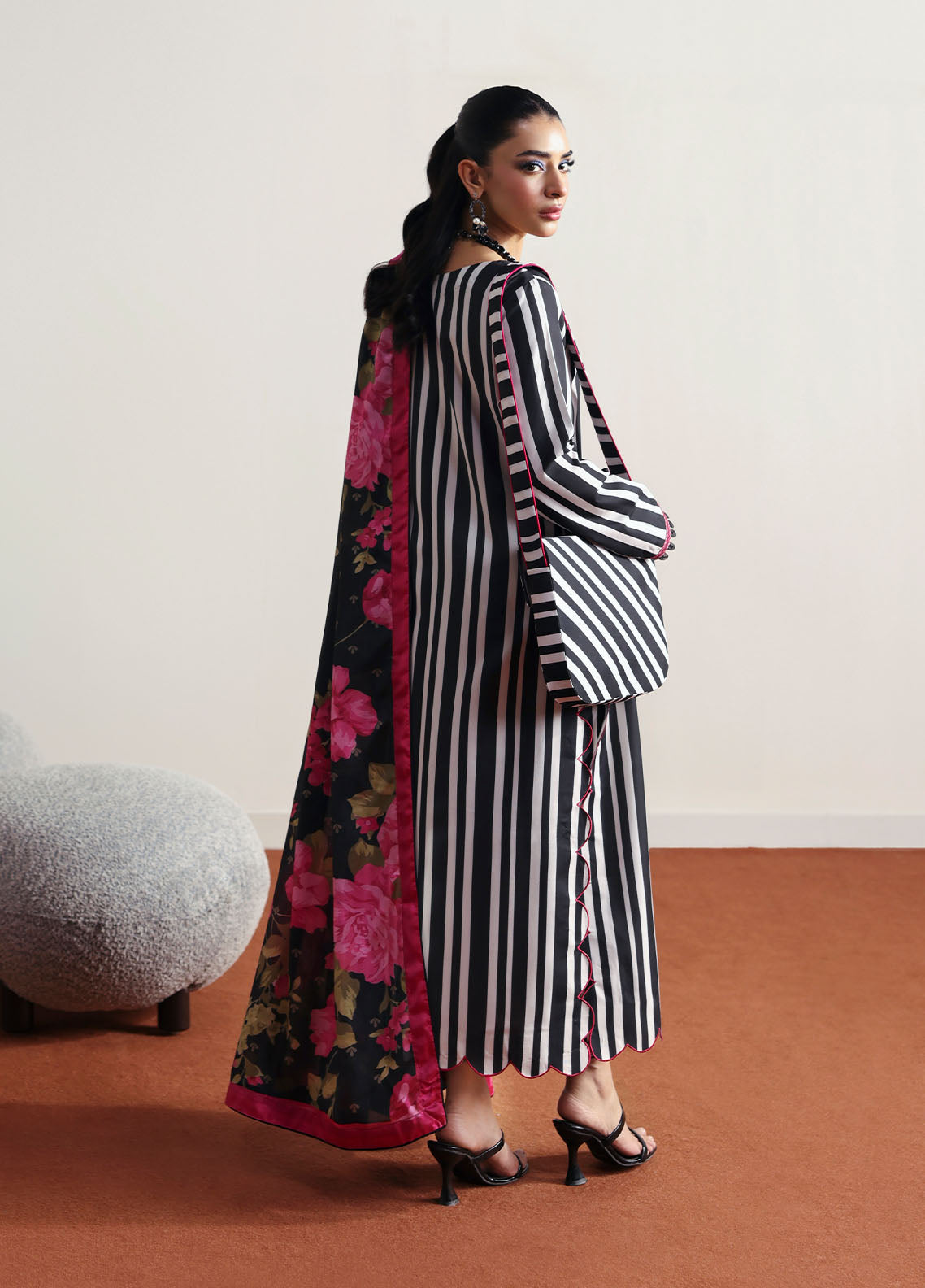 Model wearing black and white striped outfit with floral dupatta from Gulaal Basics | Fleuron, ideal Pakistani luxury pret in UK.