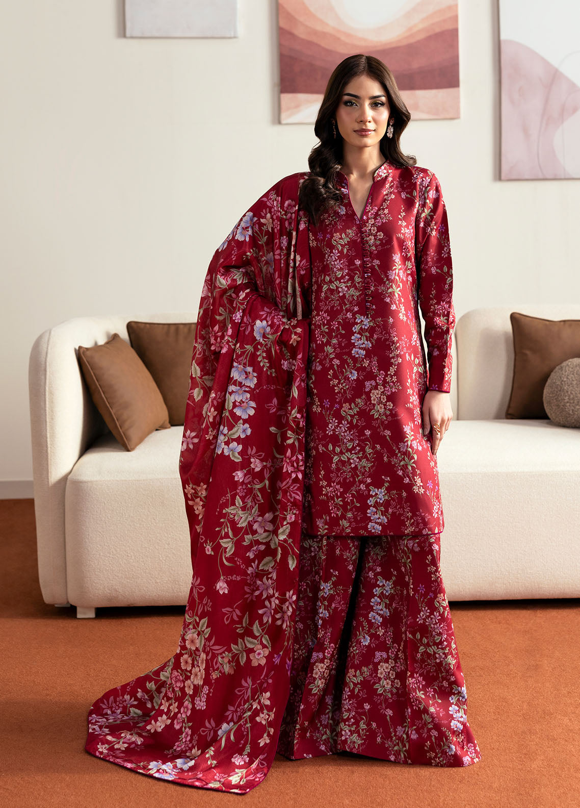 Model wearing deep red floral printed outfit from Gulaal Basics | Aster, perfect Pakistani luxury pret for Pakistani clothes online in UK.