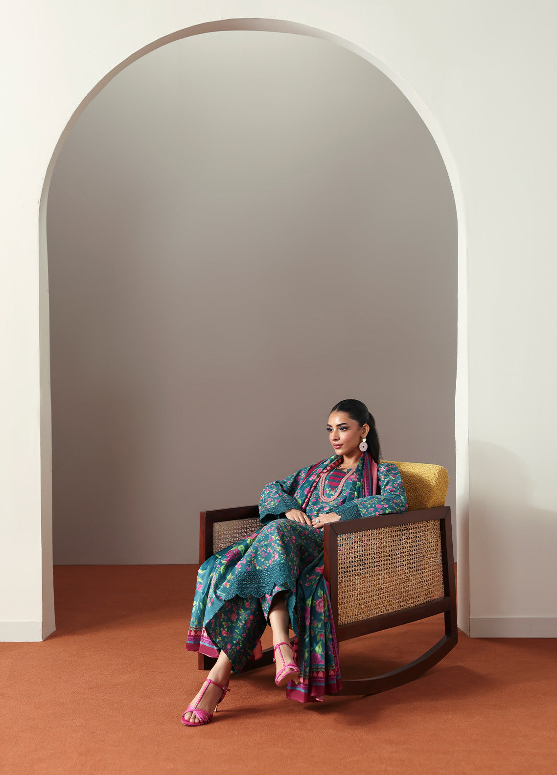 Model wearing Zeirin from Gulaal in a teal green floral printed co-ord set with pink dupatta, ideal for Pakistani luxury pret in the UK.