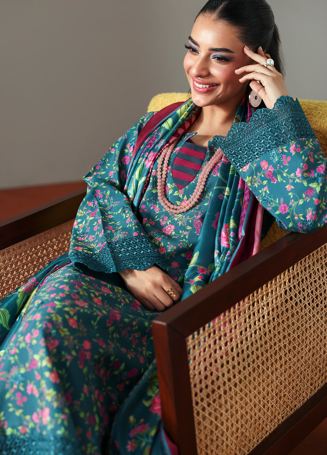 Model wearing Zeirin from Gulaal in a teal green floral printed co-ord set with pink dupatta, ideal for Pakistani luxury pret in the UK.