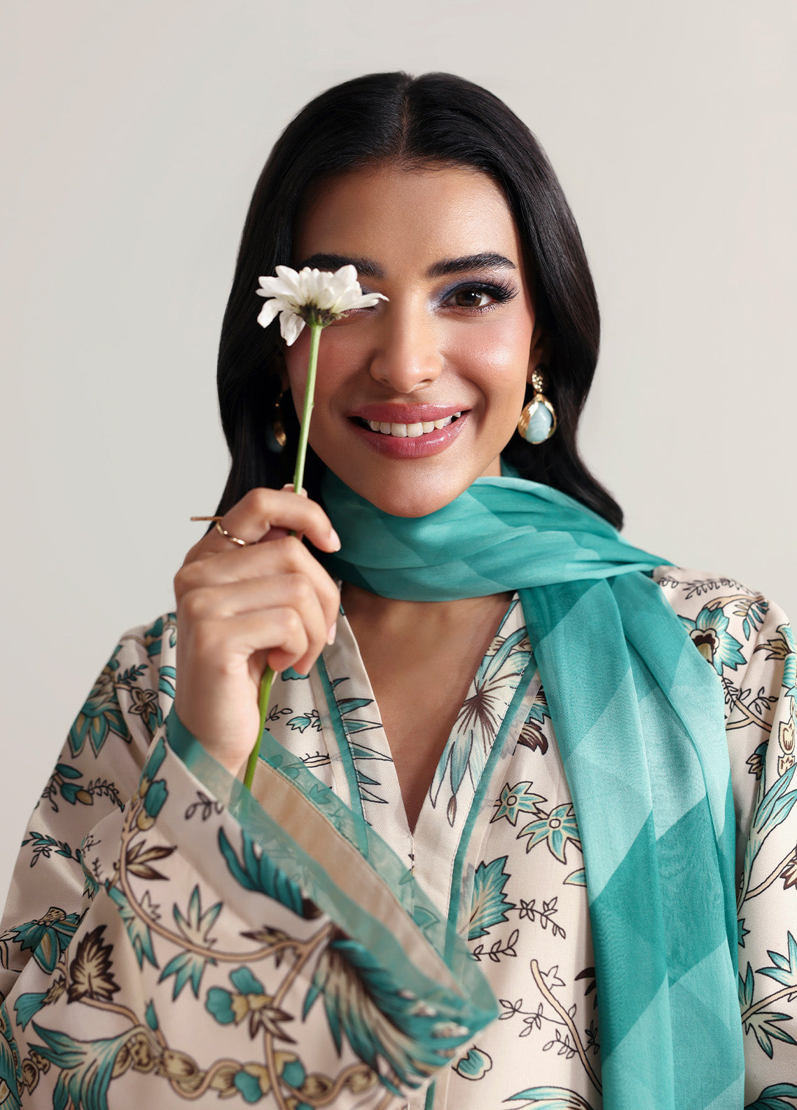 Model wearing meadowe from Gulaal in a beige printed co-ord set with teal floral design and matching dupatta, ideal for Pakistani luxury pret in the UK.