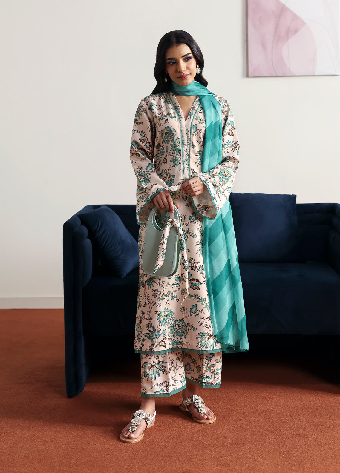Model wearing meadowe from Gulaal in a beige printed co-ord set with teal floral design and matching dupatta, ideal for Pakistani luxury pret in the UK.