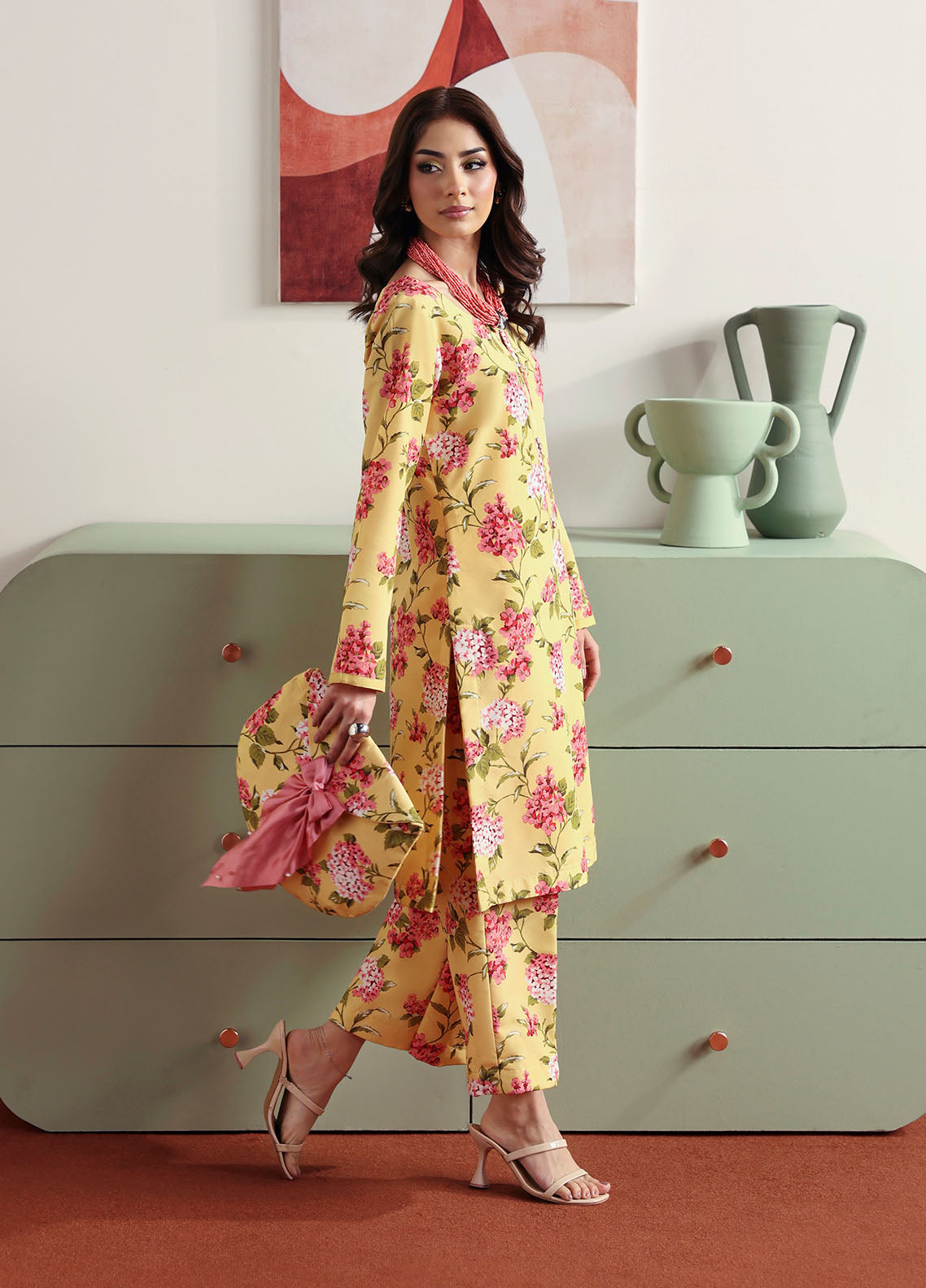 Model wearing yellow floral printed outfit from Gulaal Basics | Honey Dew, Pakistani luxury pret ideal for Pakistani clothes online in UK.