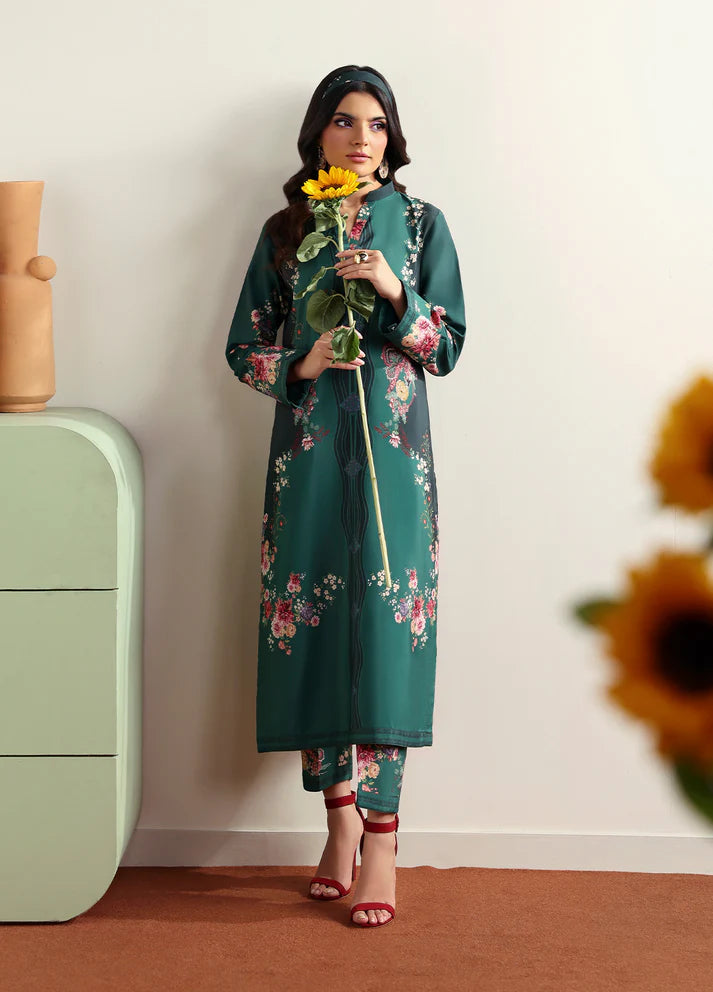 Model wearing Faye by Gulaal in deep green with floral print, a chic Pakistani luxury pret outfit – shop Pakistani clothes online in UK.