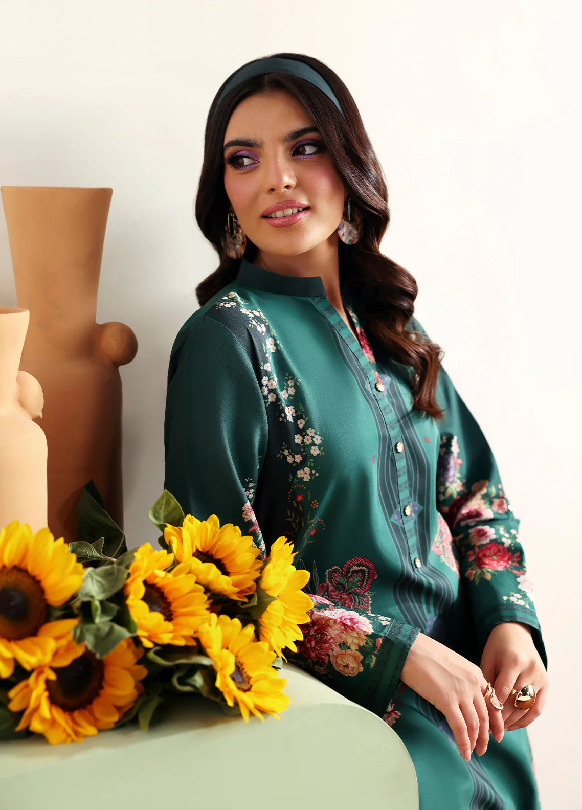 Model wearing Faye by Gulaal in deep green with floral print, a chic Pakistani luxury pret outfit – shop Pakistani clothes online in UK.