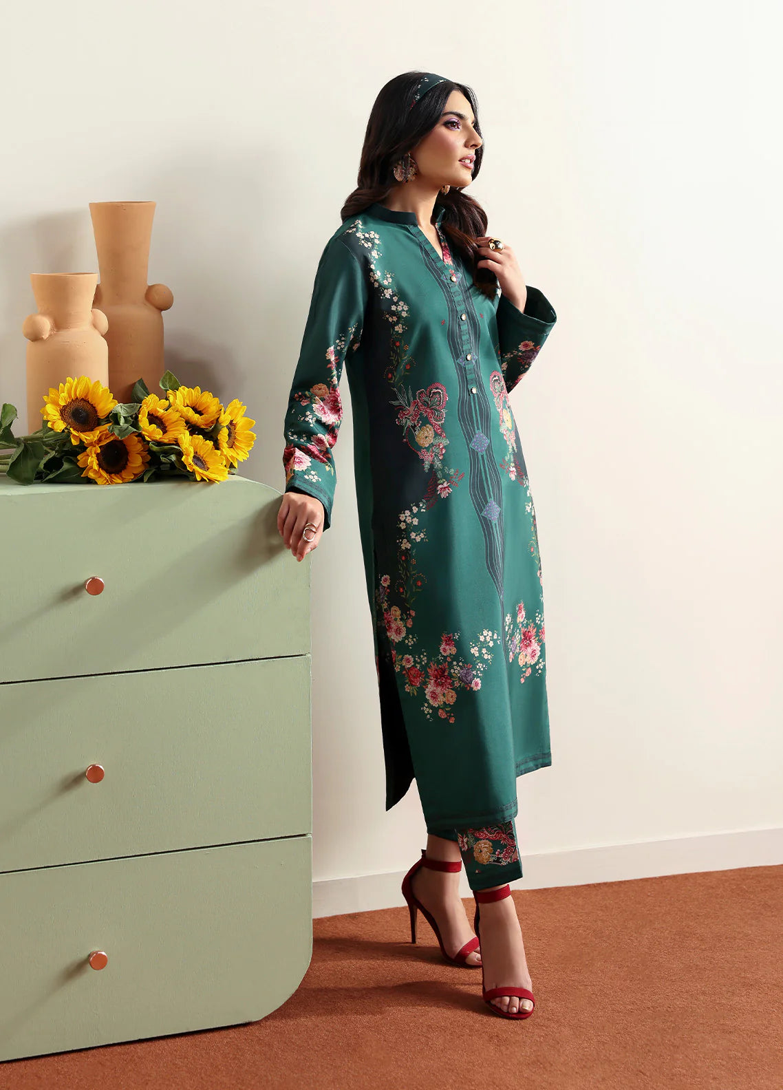 Model wearing Faye by Gulaal in deep green with floral print, a chic Pakistani luxury pret outfit – shop Pakistani clothes online in UK.