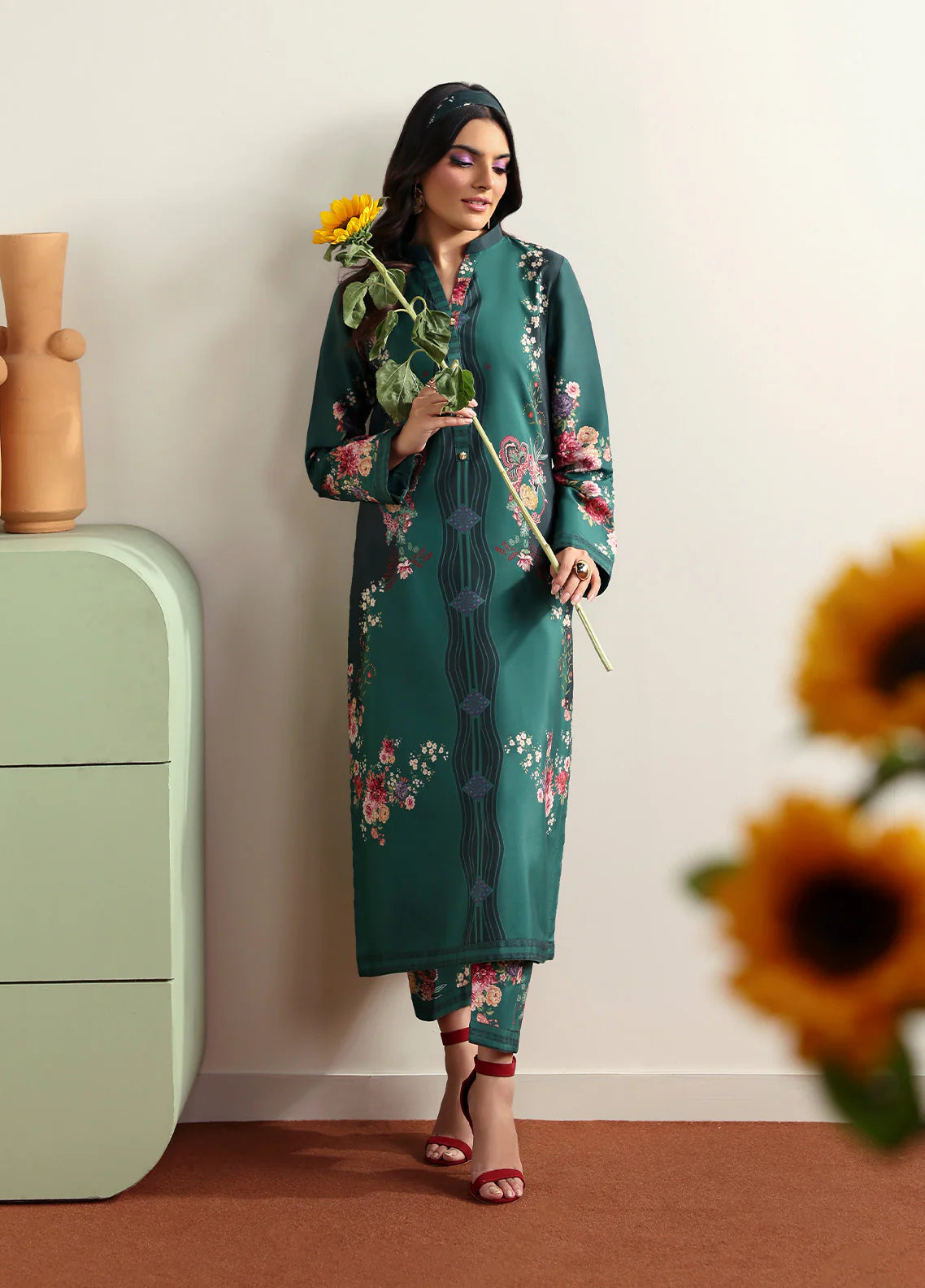 Model wearing Faye by Gulaal in deep green with floral print, a chic Pakistani luxury pret outfit – shop Pakistani clothes online in UK.