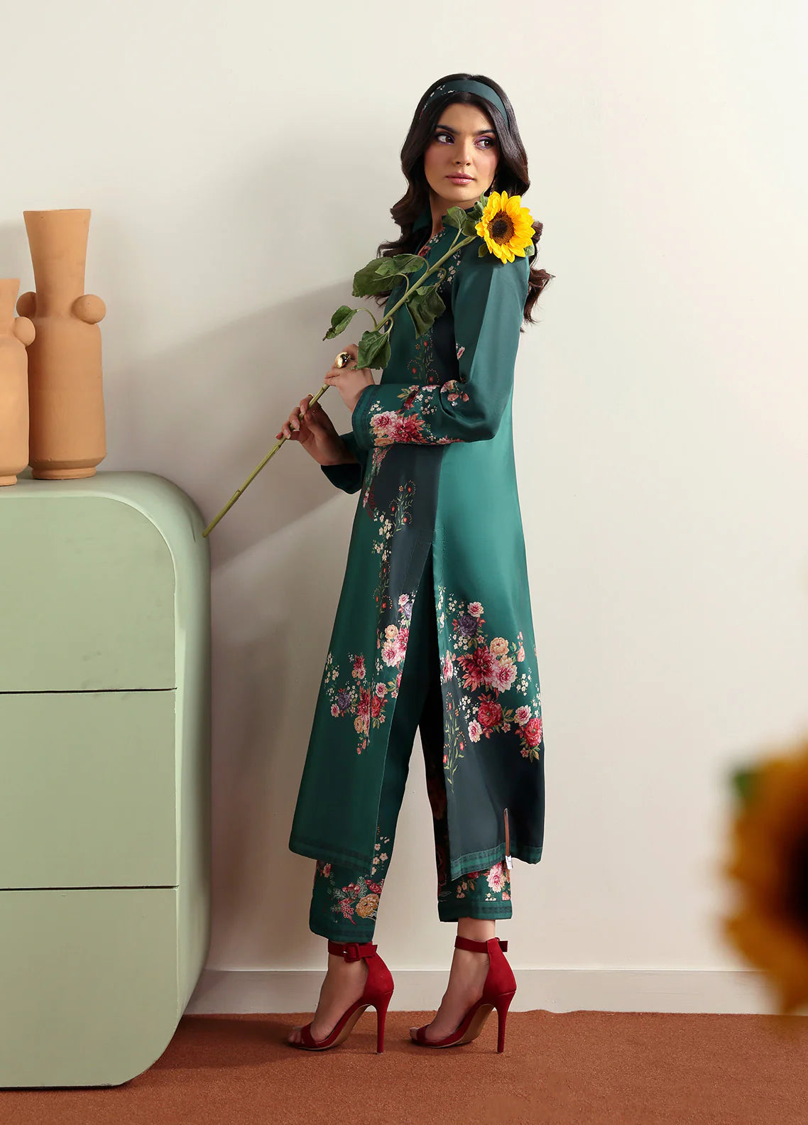 Model wearing Faye by Gulaal in deep green with floral print, a chic Pakistani luxury pret outfit – shop Pakistani clothes online in UK.