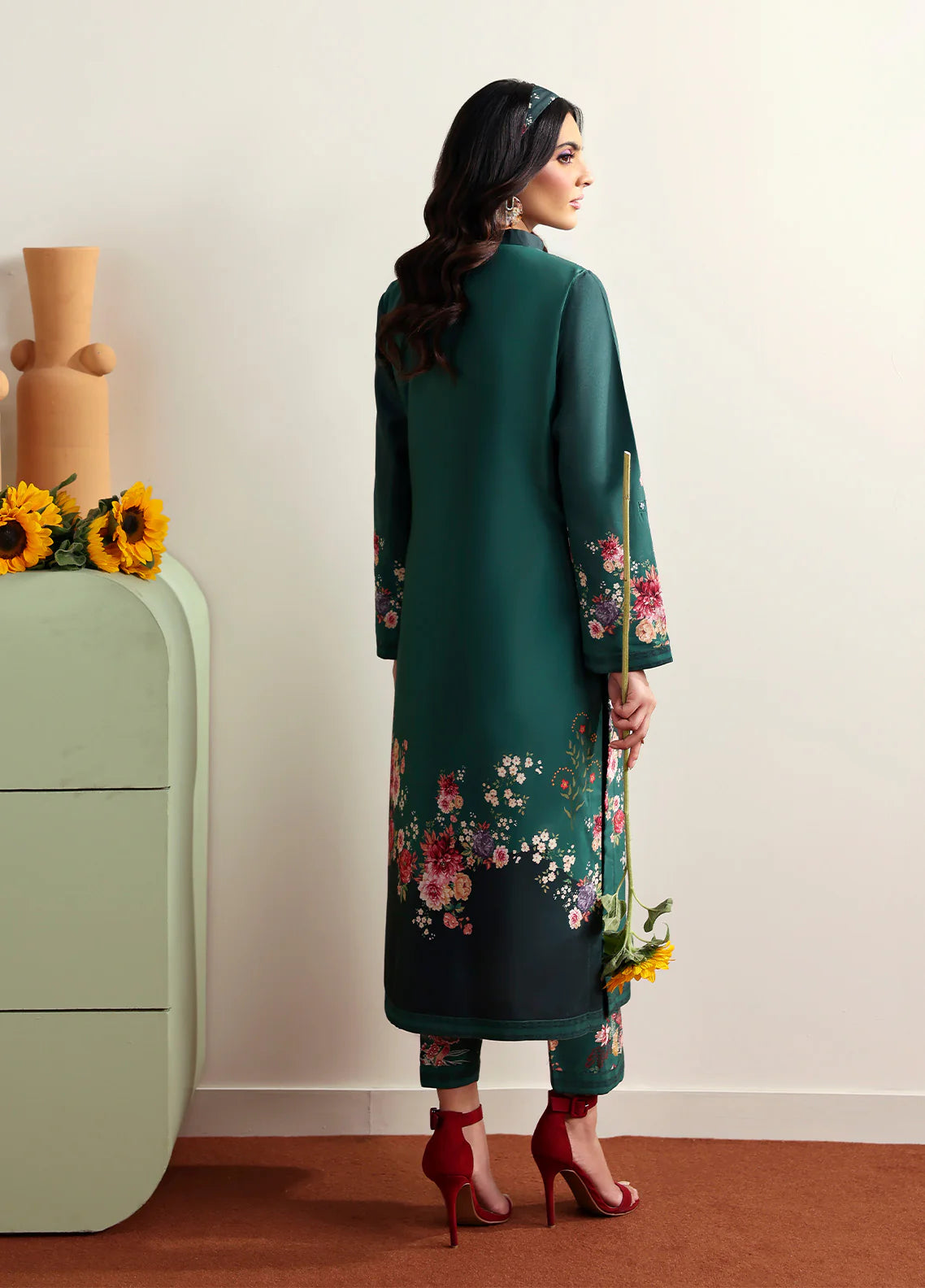 Model wearing Faye by Gulaal in deep green with floral print, a chic Pakistani luxury pret outfit – shop Pakistani clothes online in UK.