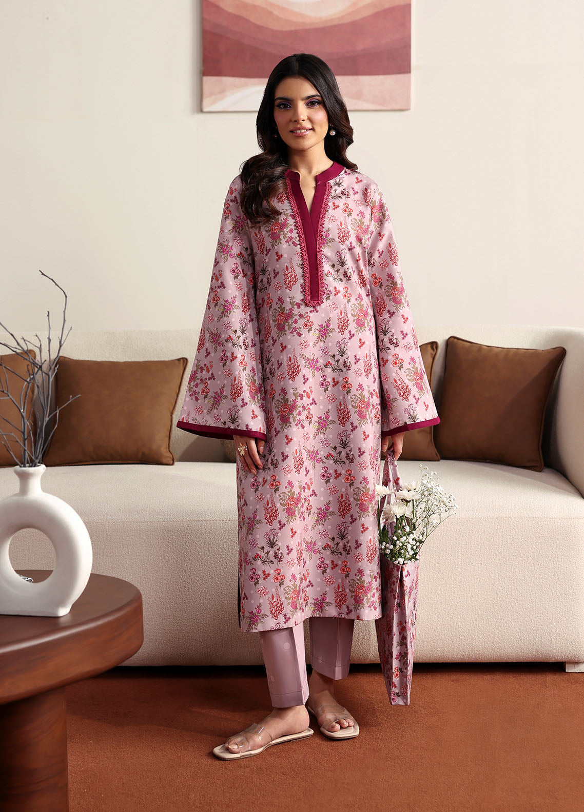 Model wearing pink floral printed outfit from Gulaal Basics | Blossom, Pakistani luxury pret for Pakistani clothes online in UK.