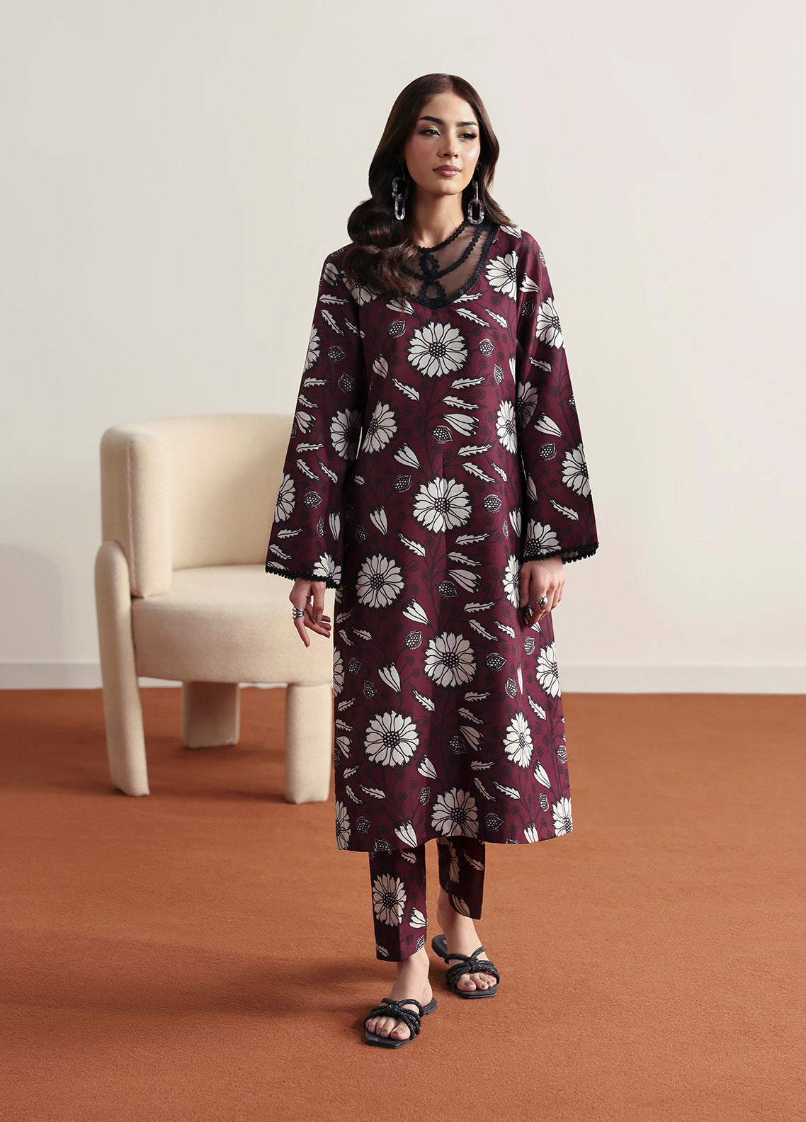 Model wearing Evra from Gulaal in a deep maroon printed co-ord set with bold white floral patterns, perfect for Pakistani luxury pret in the UK.