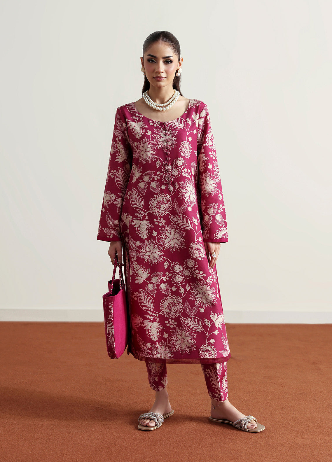 Model wearing Rosalee from Gulaal in a deep pink printed co-ord set with ivory floral patterns, perfect for Pakistani luxury pret in the UK.