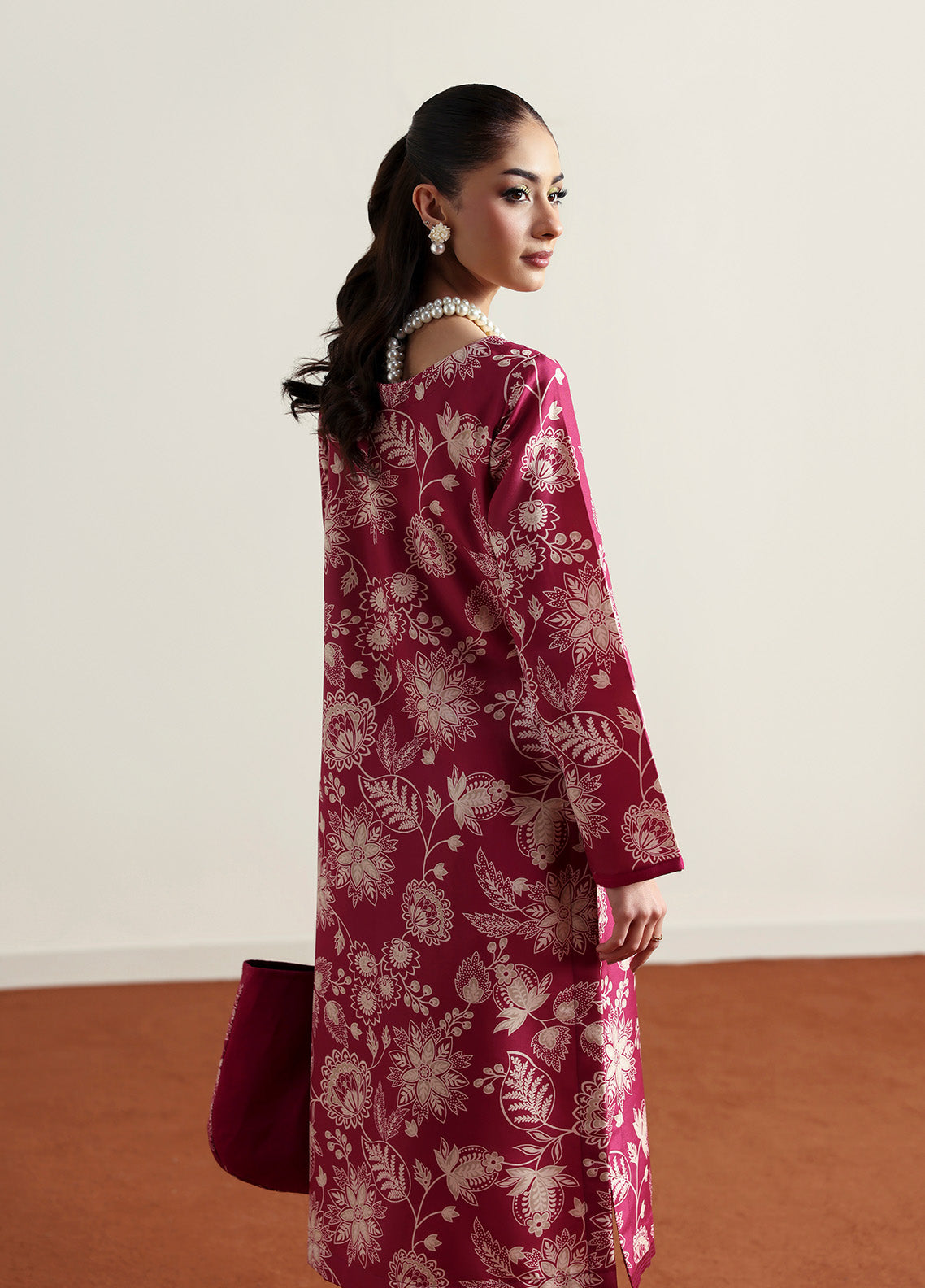 Model wearing Rosalee from Gulaal in a deep pink printed co-ord set with ivory floral patterns, perfect for Pakistani luxury pret in the UK.