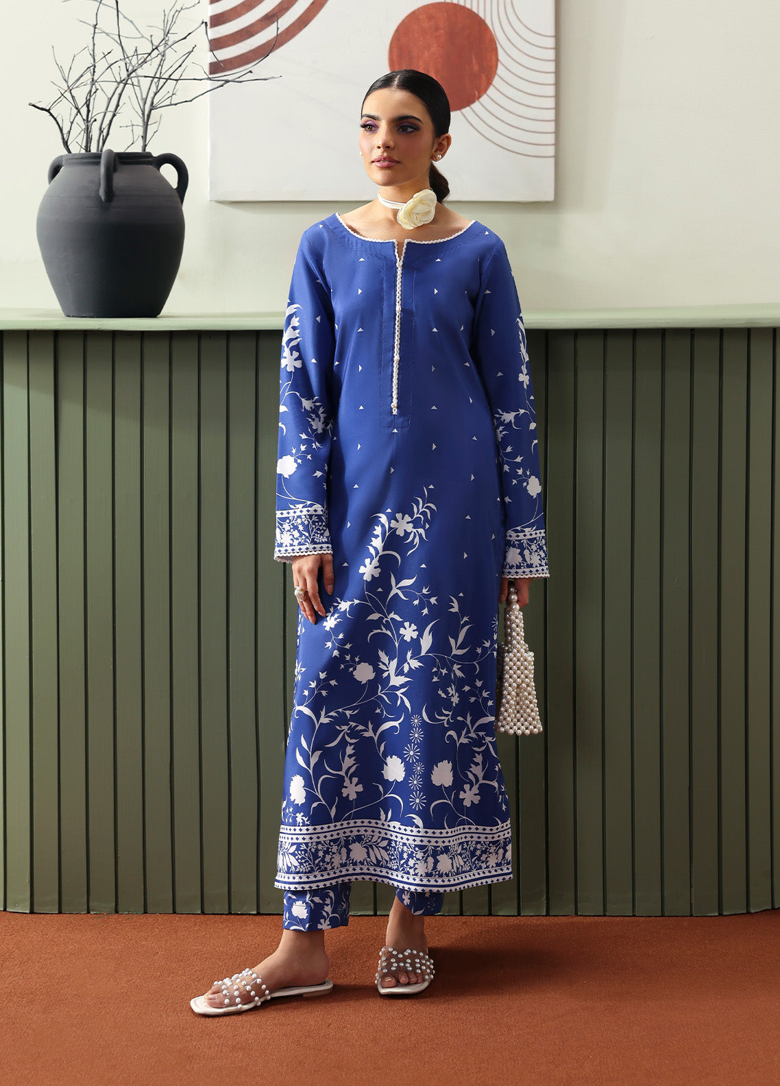 Model wearing Liyanah from Gulaal in a cobalt blue co-ord set with white floral print, perfect for Pakistani luxury pret and casual wear in the UK.