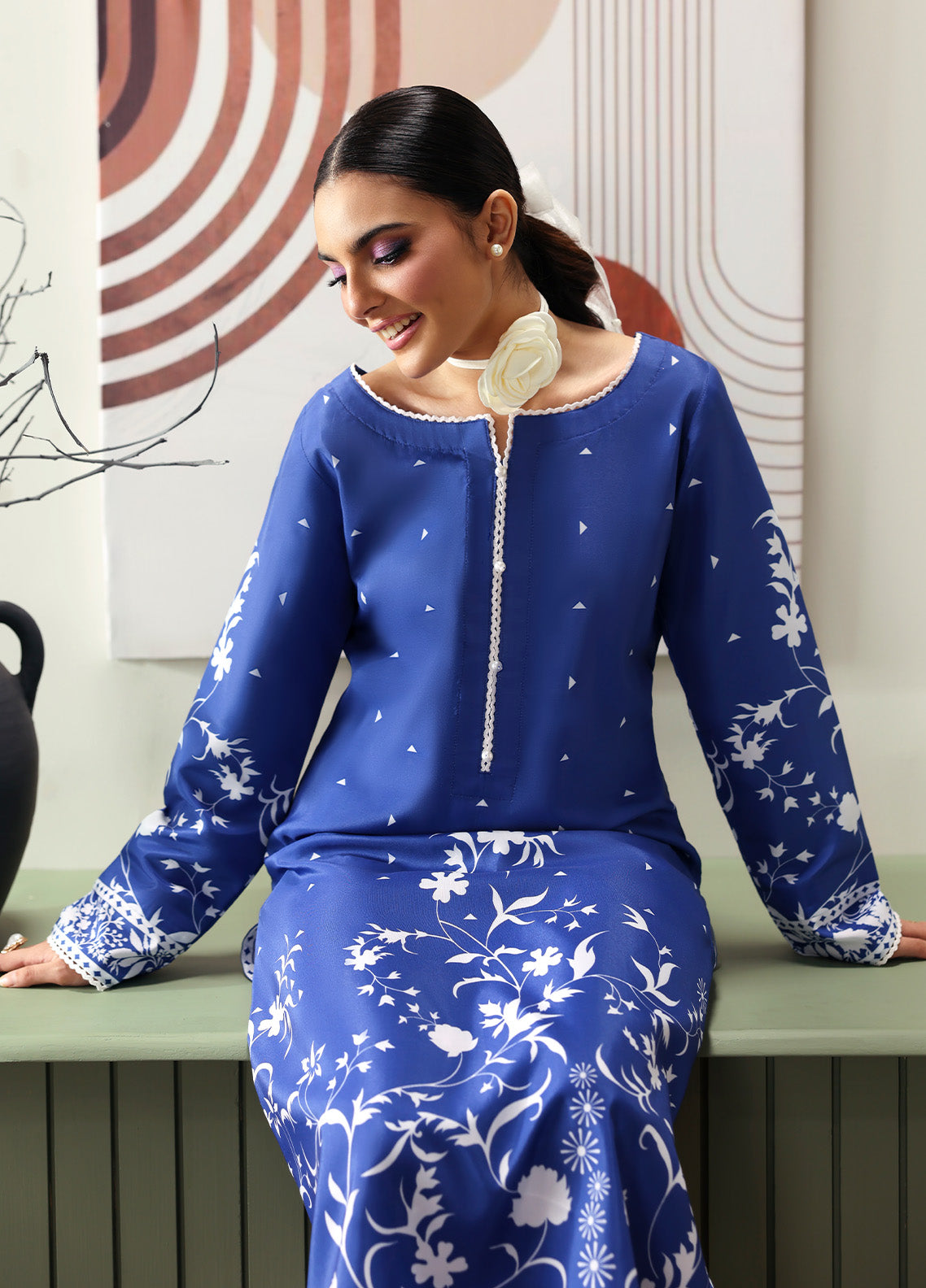 Model wearing Liyanah from Gulaal in a cobalt blue co-ord set with white floral print, perfect for Pakistani luxury pret and casual wear in the UK.