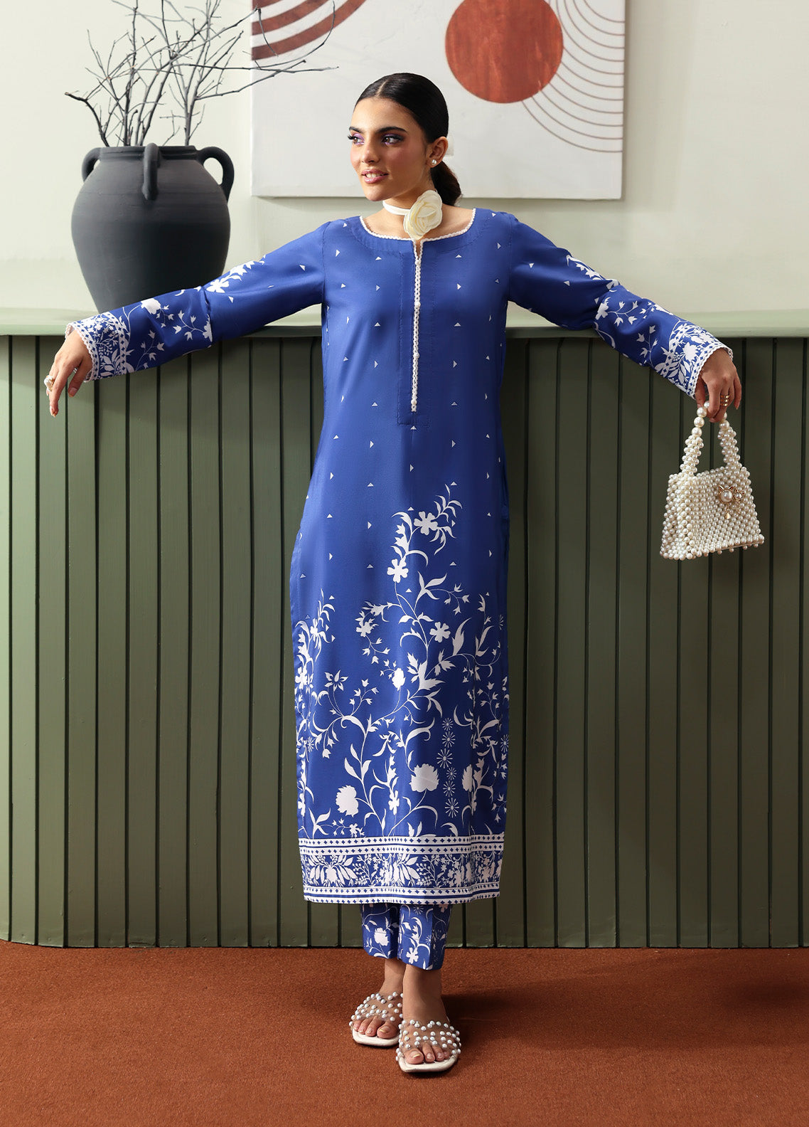 Model wearing Liyanah from Gulaal in a cobalt blue co-ord set with white floral print, perfect for Pakistani luxury pret and casual wear in the UK.