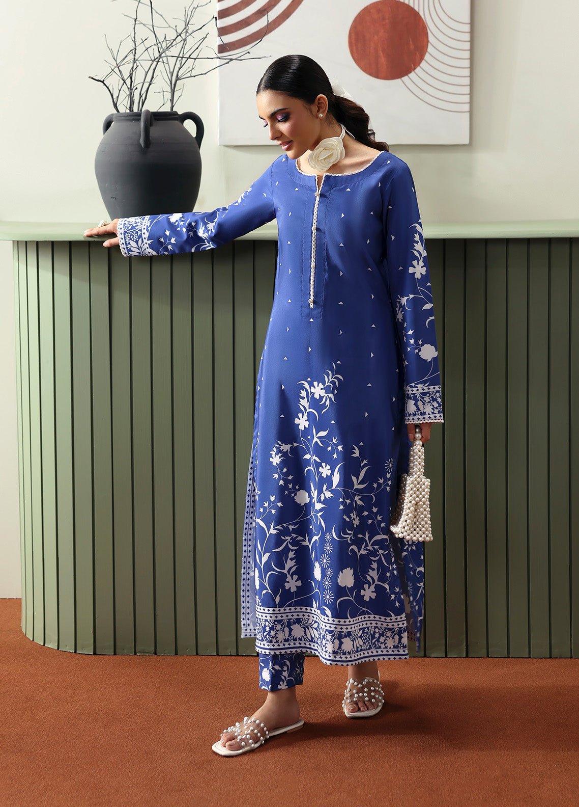 Model wearing Liyanah from Gulaal in a cobalt blue co-ord set with white floral print, perfect for Pakistani luxury pret and casual wear in the UK.