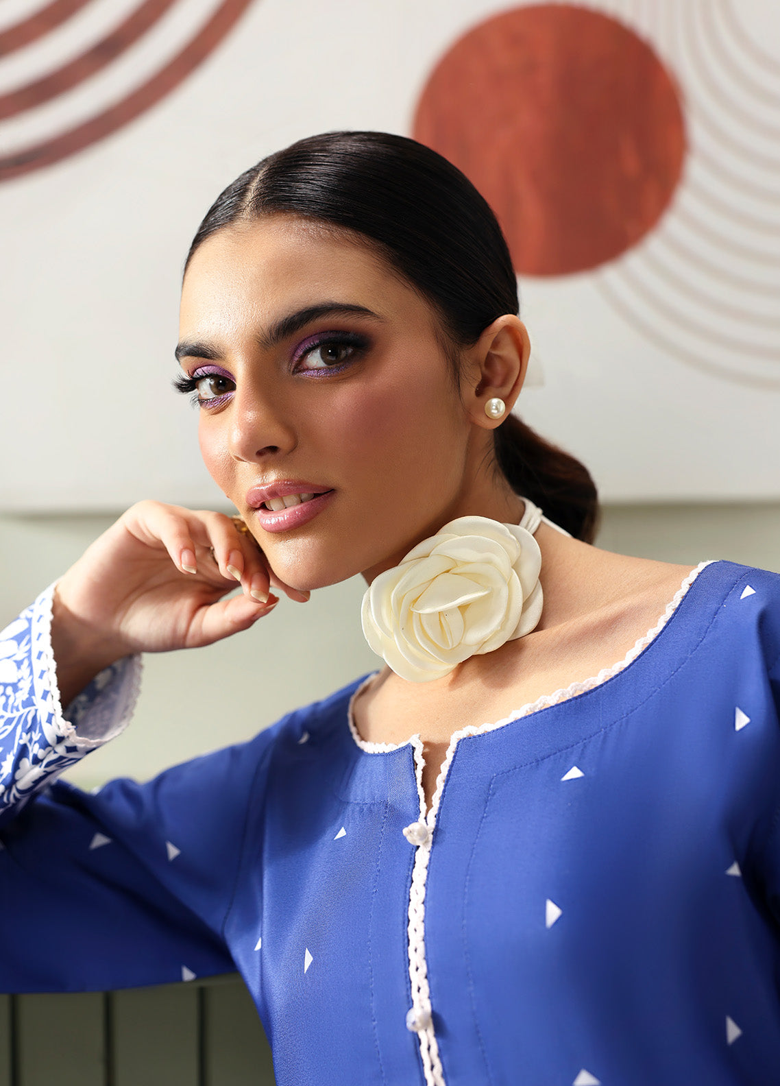 Model wearing Liyanah from Gulaal in a cobalt blue co-ord set with white floral print, perfect for Pakistani luxury pret and casual wear in the UK.
