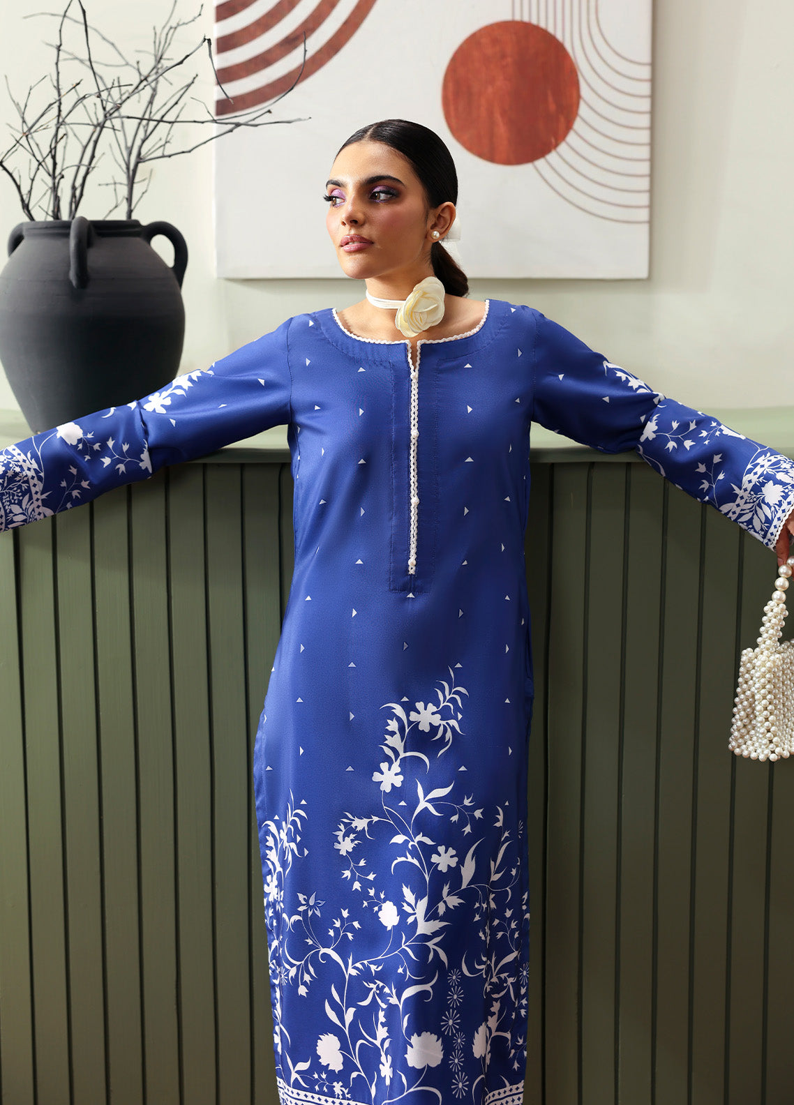 Model wearing Liyanah from Gulaal in a cobalt blue co-ord set with white floral print, perfect for Pakistani luxury pret and casual wear in the UK.
