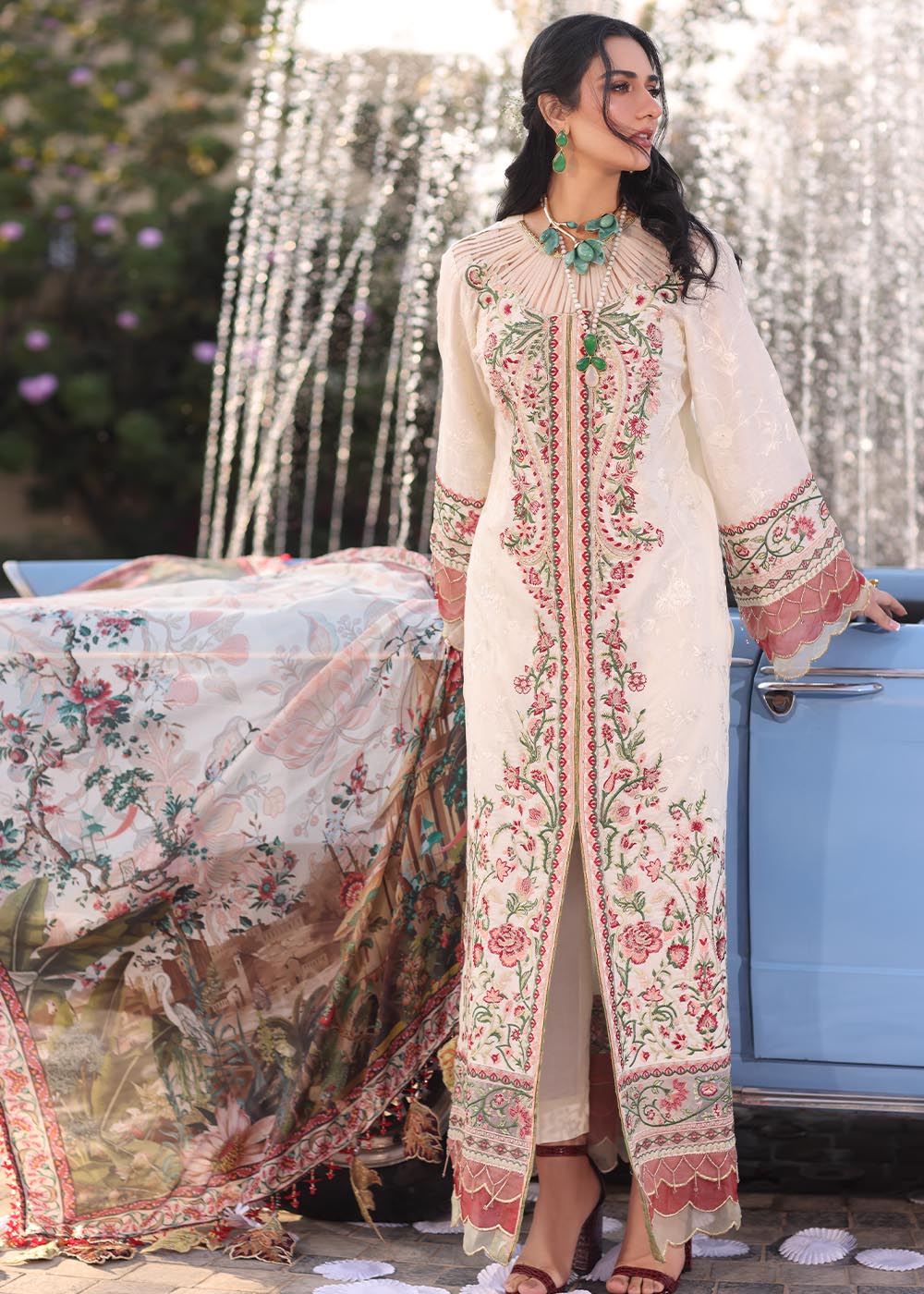 Model wearing off-white and multicolour floral embroidered dress with printed dupatta from Musferah Saad Pretty Girls Luxury Lawn 2025 Bloome. Pakistani clothes online UK.