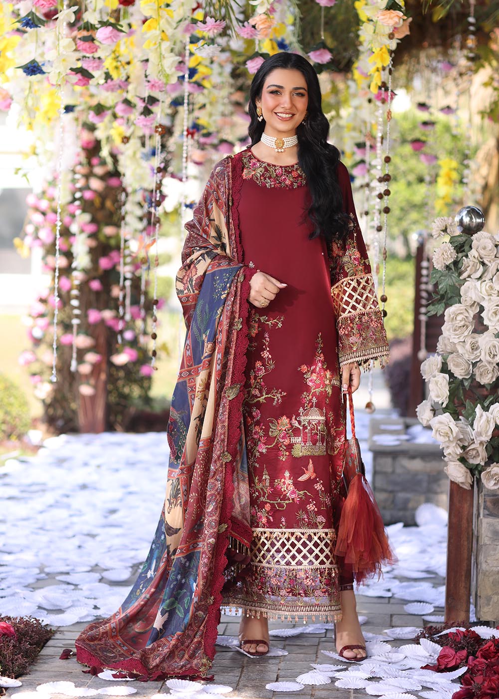 Model wearing deep maroon embroidered dress with printed dupatta from Musferah Saad Pretty Girls Luxury Lawn '25 Rosabel, Pakistani clothes online in UK.