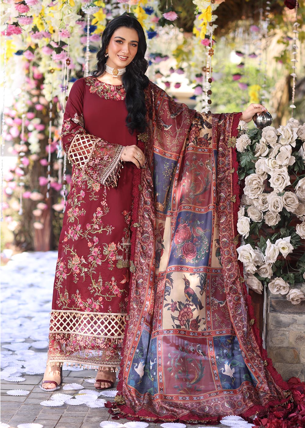 Model wearing deep maroon embroidered dress with printed dupatta from Musferah Saad Pretty Girls Luxury Lawn '25 Rosabel, Pakistani clothes online in UK.