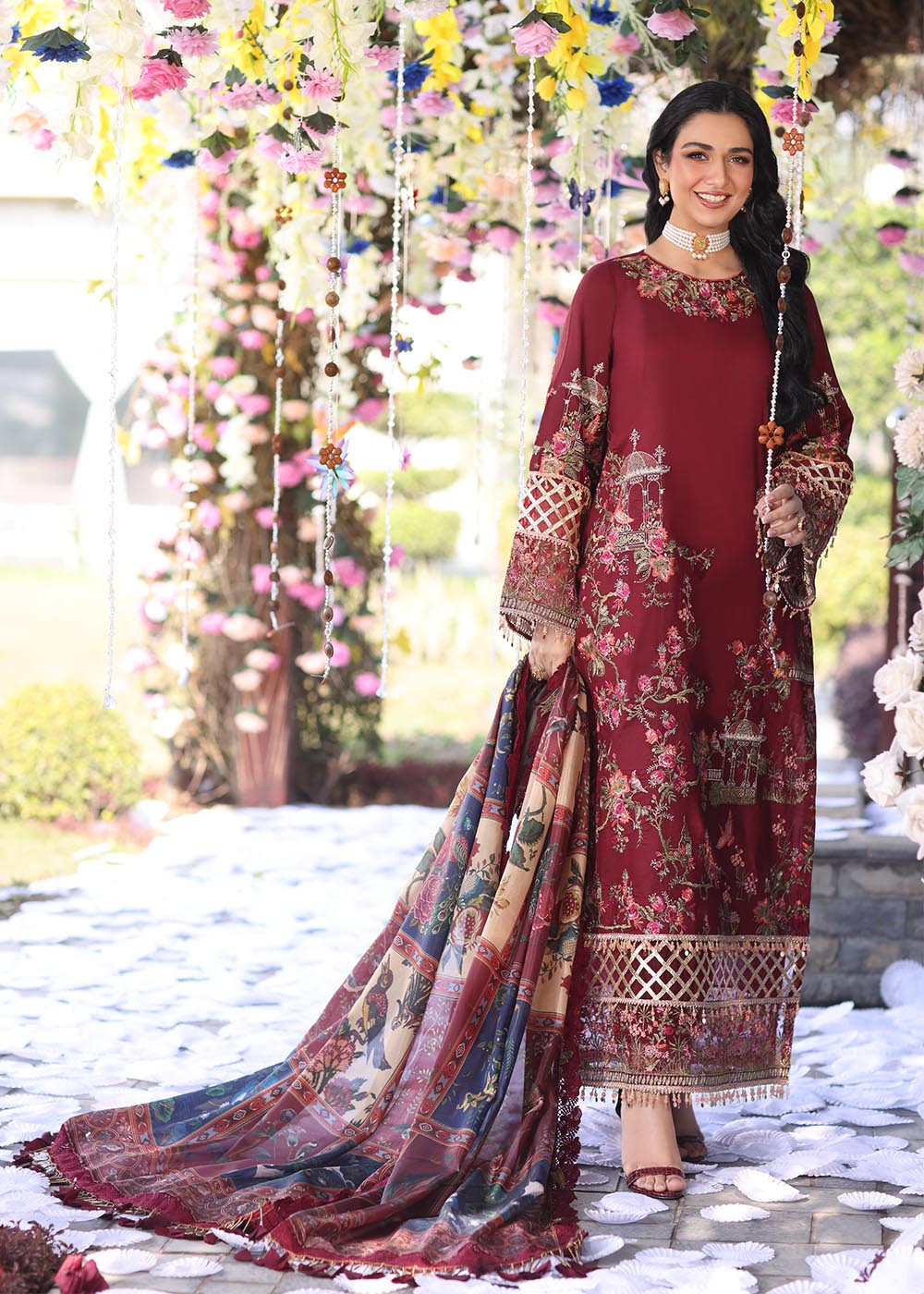 Model wearing deep maroon embroidered dress with printed dupatta from Musferah Saad Pretty Girls Luxury Lawn '25 Rosabel, Pakistani clothes online in UK.
