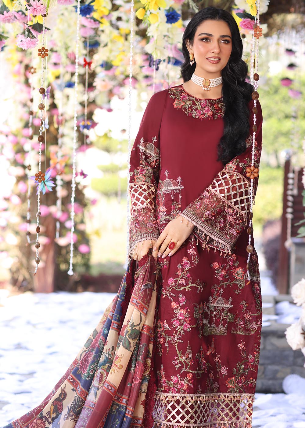 Model wearing deep maroon embroidered dress with printed dupatta from Musferah Saad Pretty Girls Luxury Lawn '25 Rosabel, Pakistani clothes online in UK.