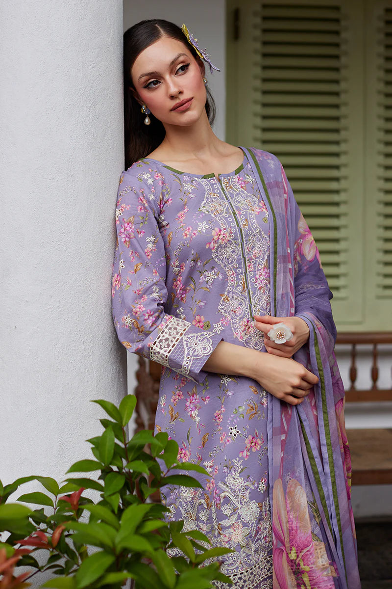Model wearing Gulaal Saffira Lawn '25 Miaa in lavender with intricate embroidery and floral printed dupatta. Shop Pakistani luxury pret online in the UK.