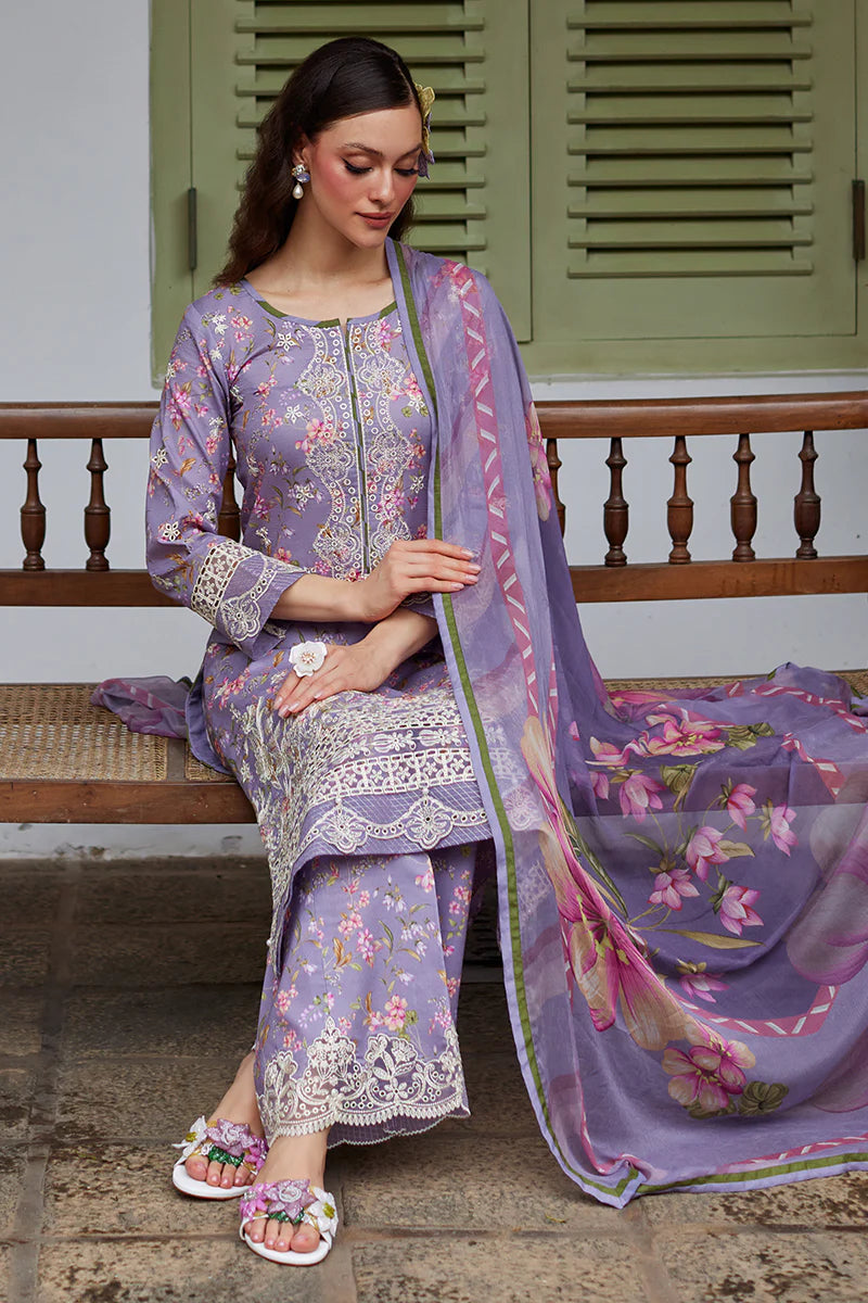 Model wearing Gulaal Saffira Lawn '25 Miaa in lavender with intricate embroidery and floral printed dupatta. Shop Pakistani luxury pret online in the UK.