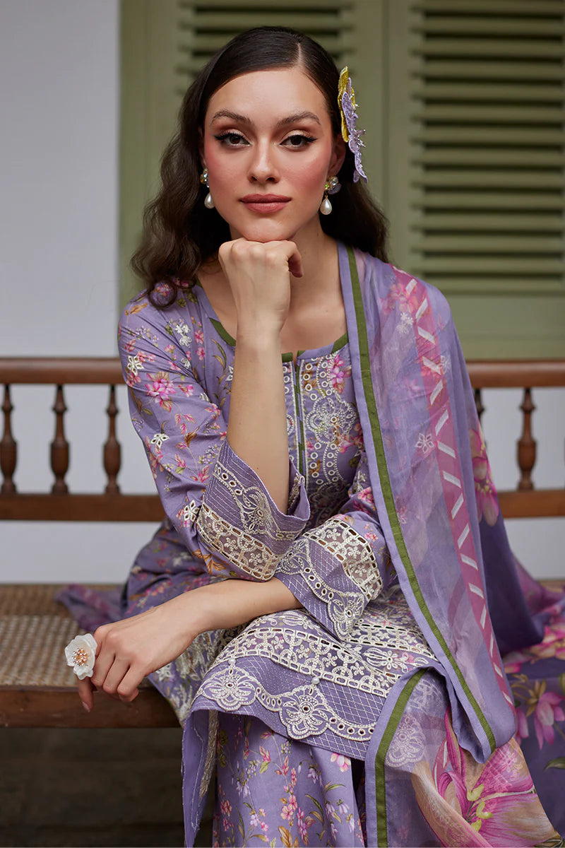 Model wearing Gulaal Saffira Lawn '25 Miaa in lavender with intricate embroidery and floral printed dupatta. Shop Pakistani luxury pret online in the UK.
