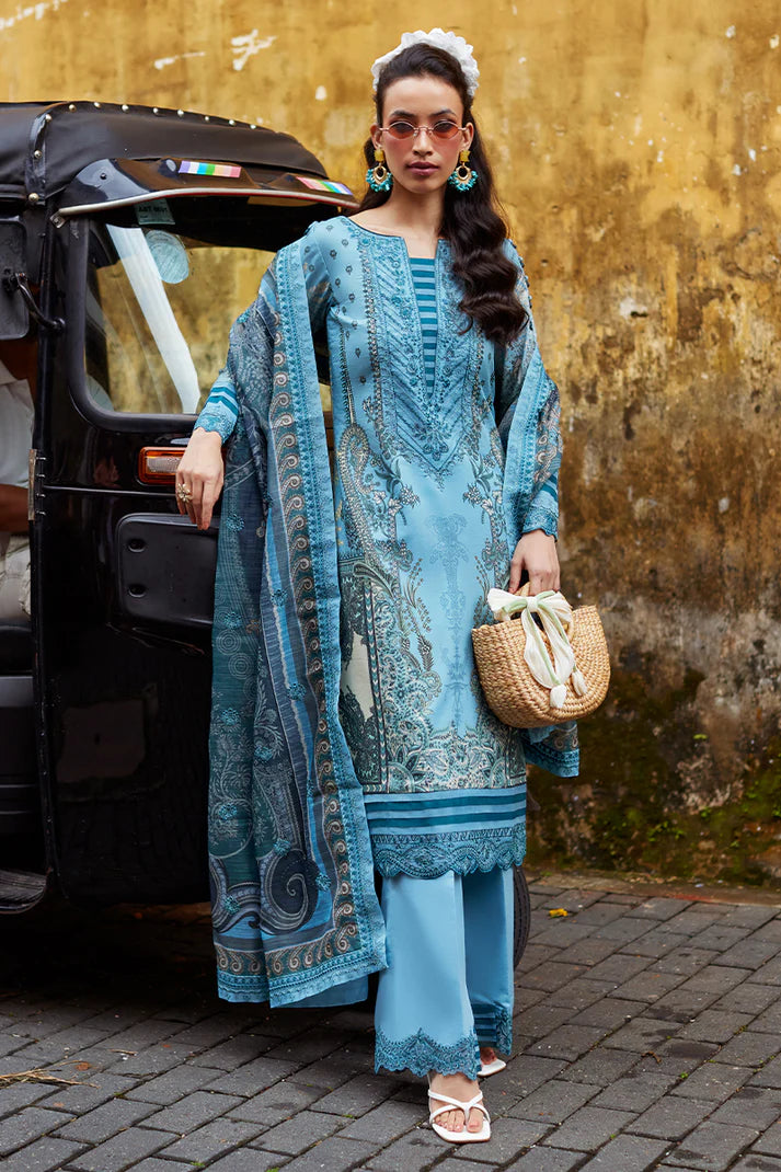 Model wearing Gulaal Saffira Lawn '25 Inayah in ice blue with intricate embroidery and lace details. Shop Pakistani luxury pret online in the UK.