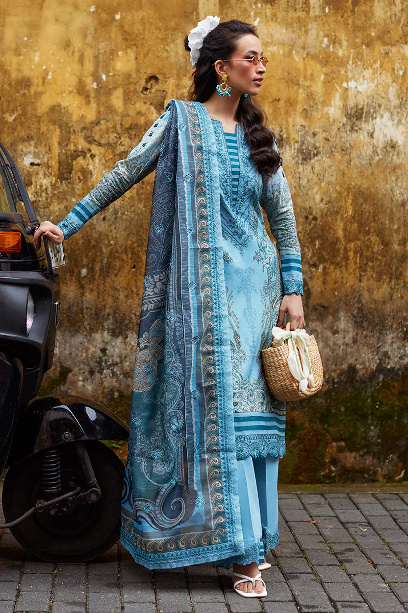 Model wearing Gulaal Saffira Lawn '25 Inayah in ice blue with intricate embroidery and lace details. Shop Pakistani luxury pret online in the UK.