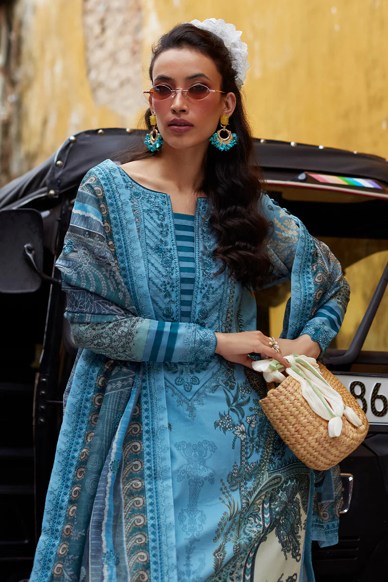 Model wearing Gulaal Saffira Lawn '25 Inayah in ice blue with intricate embroidery and lace details. Shop Pakistani luxury pret online in the UK.
