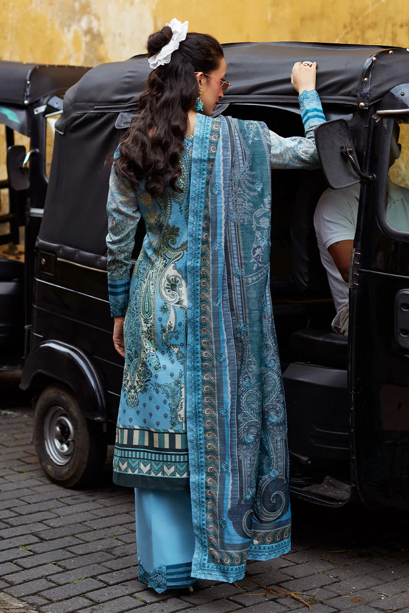 Model wearing Gulaal Saffira Lawn '25 Inayah in ice blue with intricate embroidery and lace details. Shop Pakistani luxury pret online in the UK.