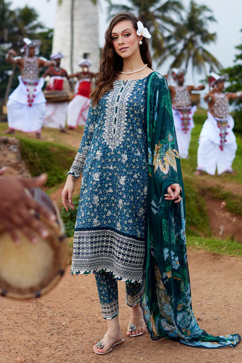 Model wearing Gulaal Saffira Lawn '25 Chloe in deep blue with intricate embroidery and printed dupatta. Shop Pakistani luxury pret online in the UK.