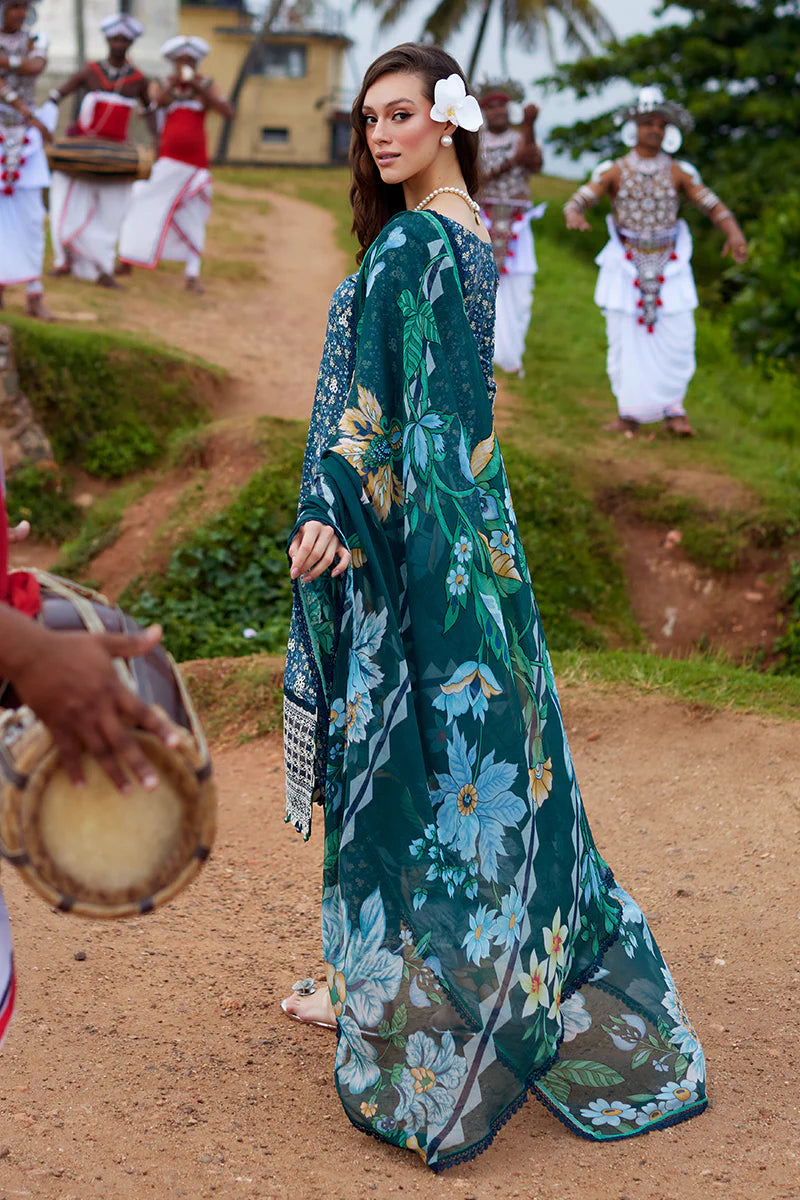 Model wearing Gulaal Saffira Lawn '25 Chloe in deep blue with intricate embroidery and printed dupatta. Shop Pakistani luxury pret online in the UK.