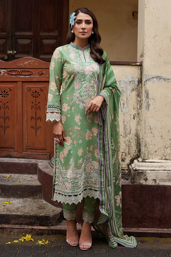 Model wearing Gulaal Saffira Lawn '25 Nora in green with intricate floral embroidery and lace detailing. Shop Pakistani luxury pret online in the UK.