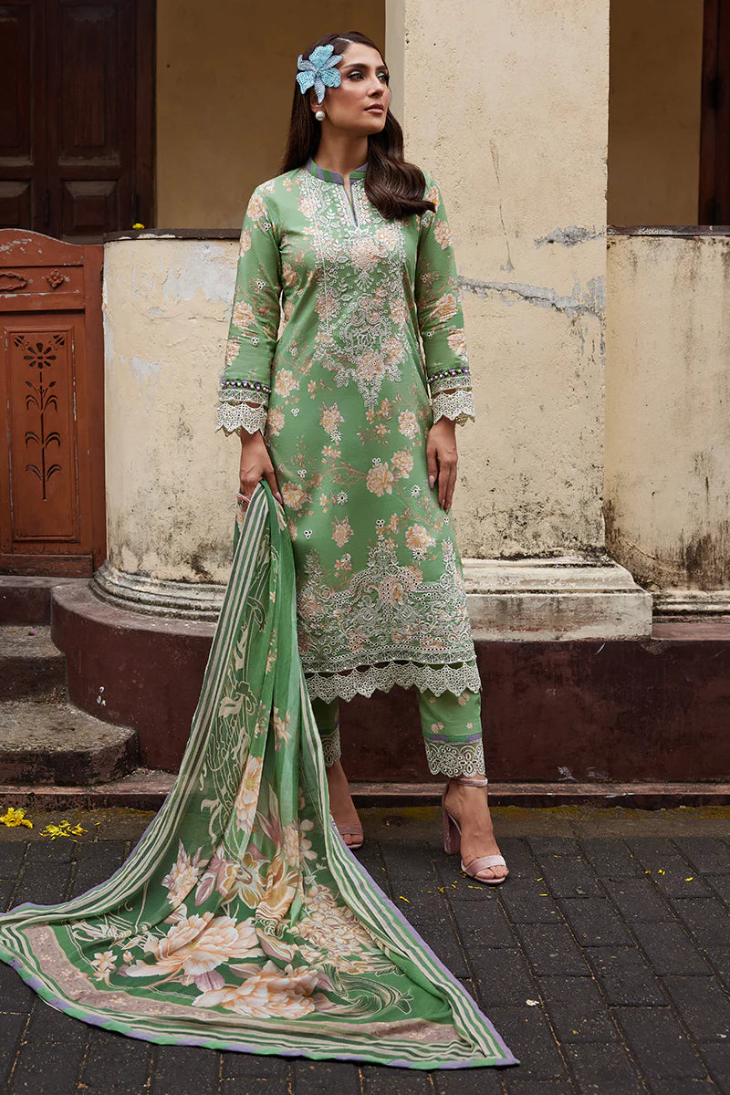Model wearing Gulaal Saffira Lawn '25 Nora in green with intricate floral embroidery and lace detailing. Shop Pakistani luxury pret online in the UK.